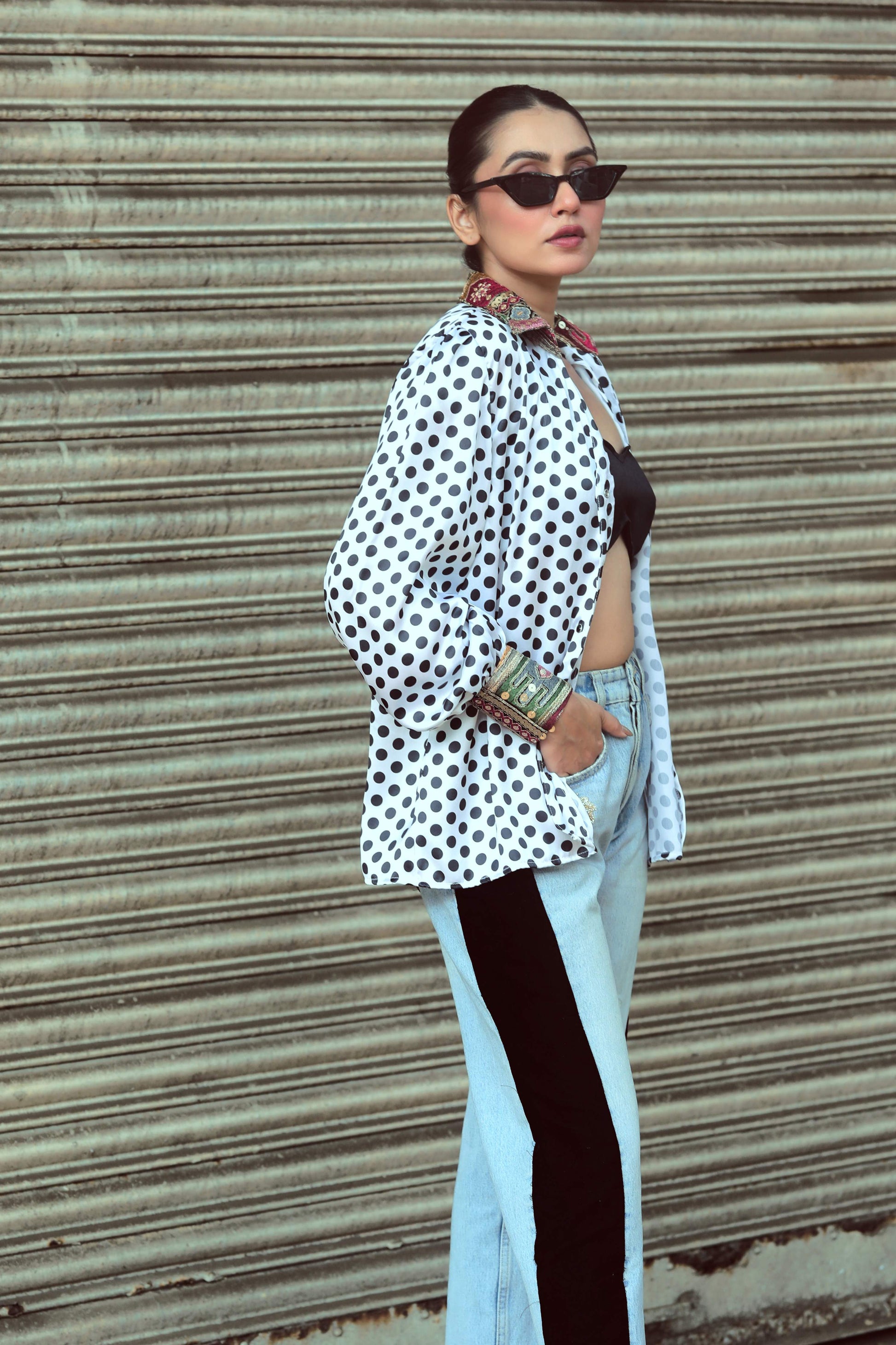 66aura Plot Twist shirt featuring a stylish design, displayed on a model, showcasing the casual fit and trendy graphic print.