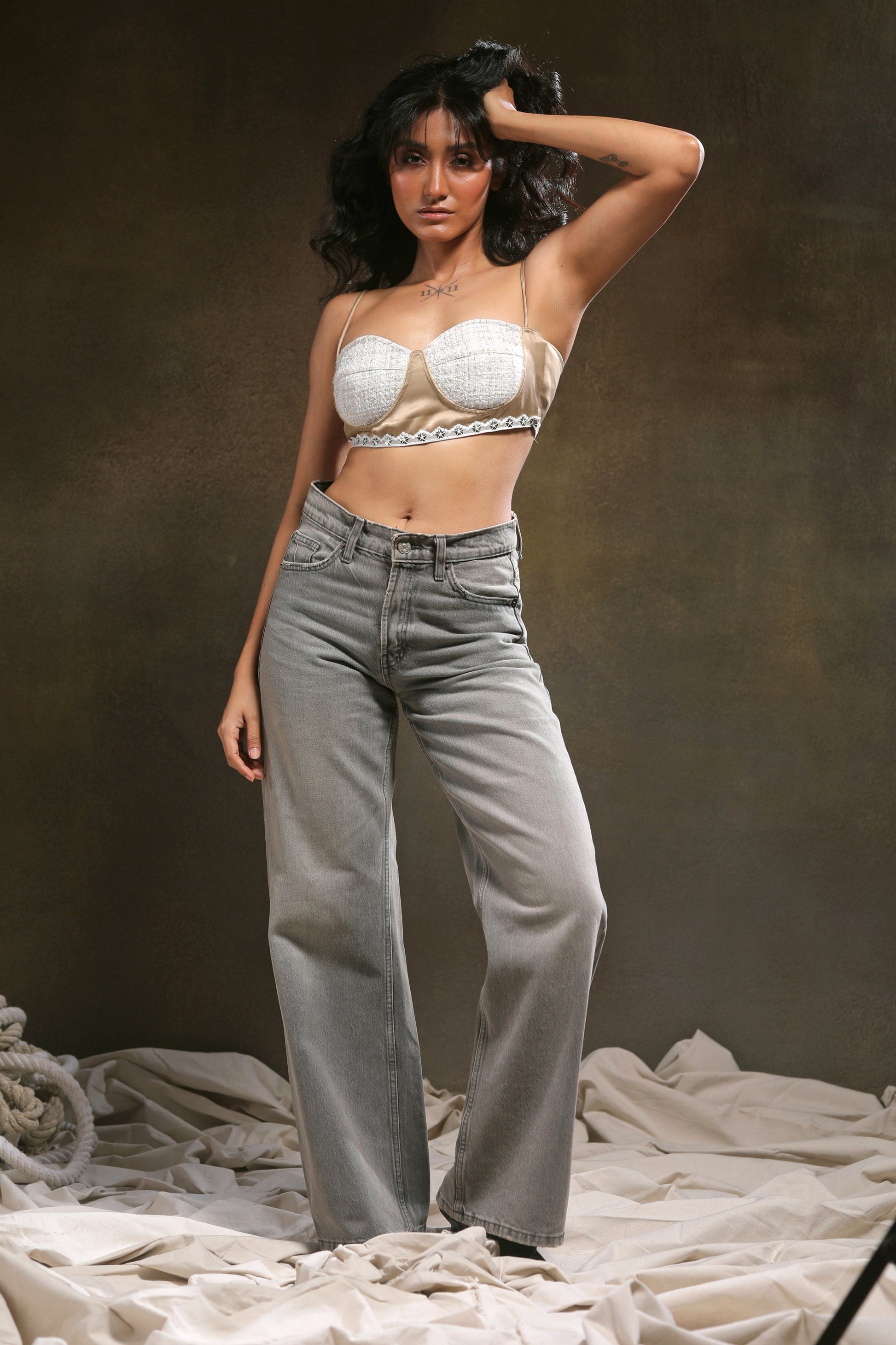 66aura Corporate Crush Bralette featuring smooth black fabric, delicate straps, and minimalist design on a plain background.