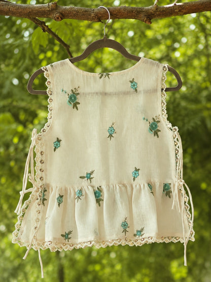 66aura Monaco Muse Top displayed on a hanger, featuring a stylish, lightweight fabric with a relaxed fit and subtle pattern.