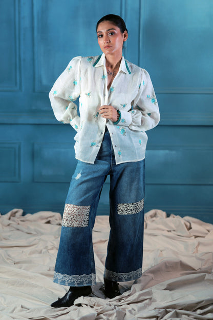 Oversized Chill Charm shirt by 66aura, featuring a relaxed fit and casual style, displayed on a hanger with neutral background.