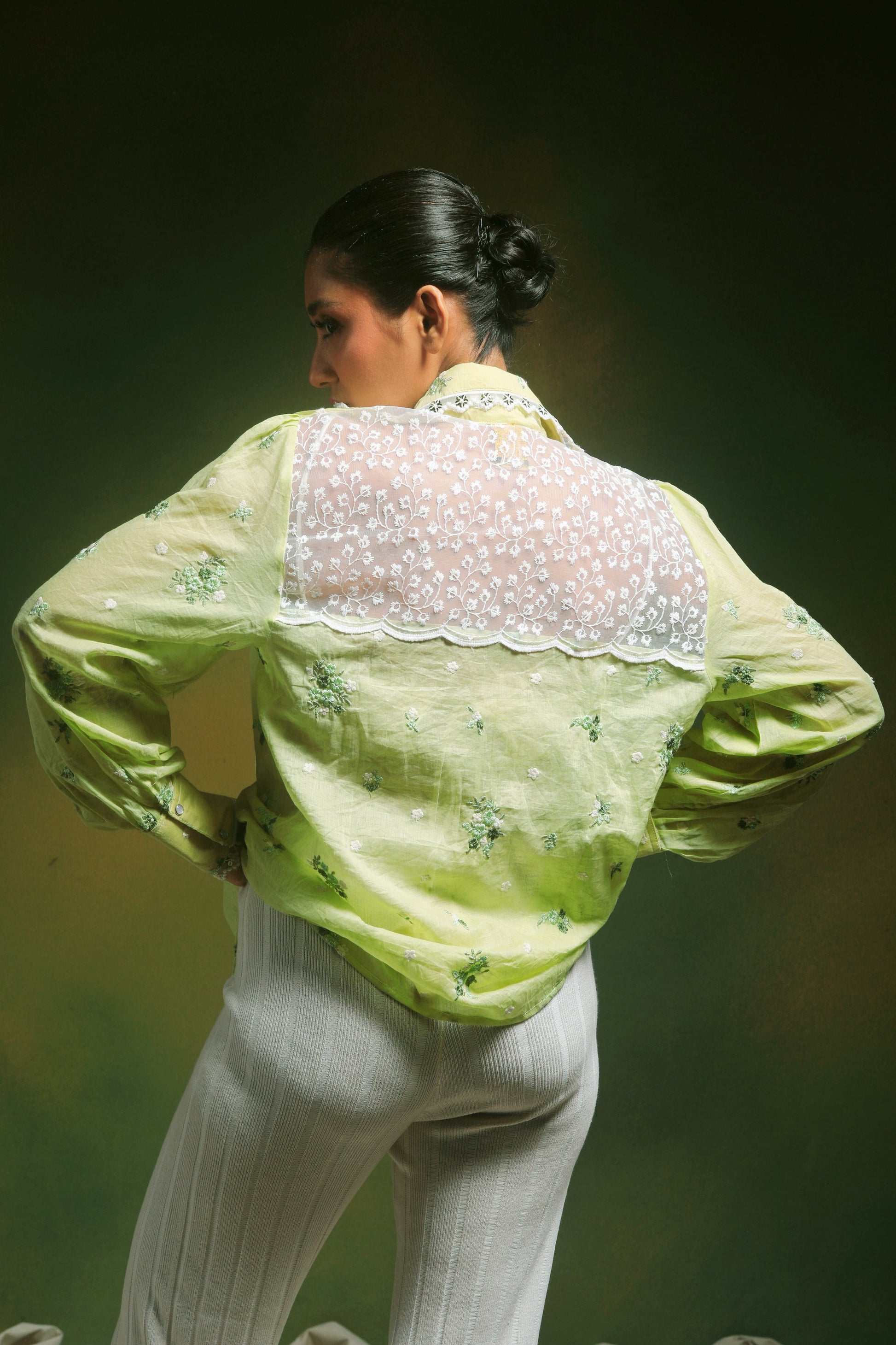 Light mint green oversized shirt by 66aura featuring a relaxed fit and soft fabric, styled casually on a model.