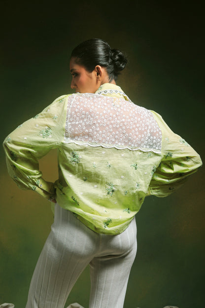 Light mint green oversized shirt by 66aura featuring a relaxed fit and soft fabric, styled casually on a model.