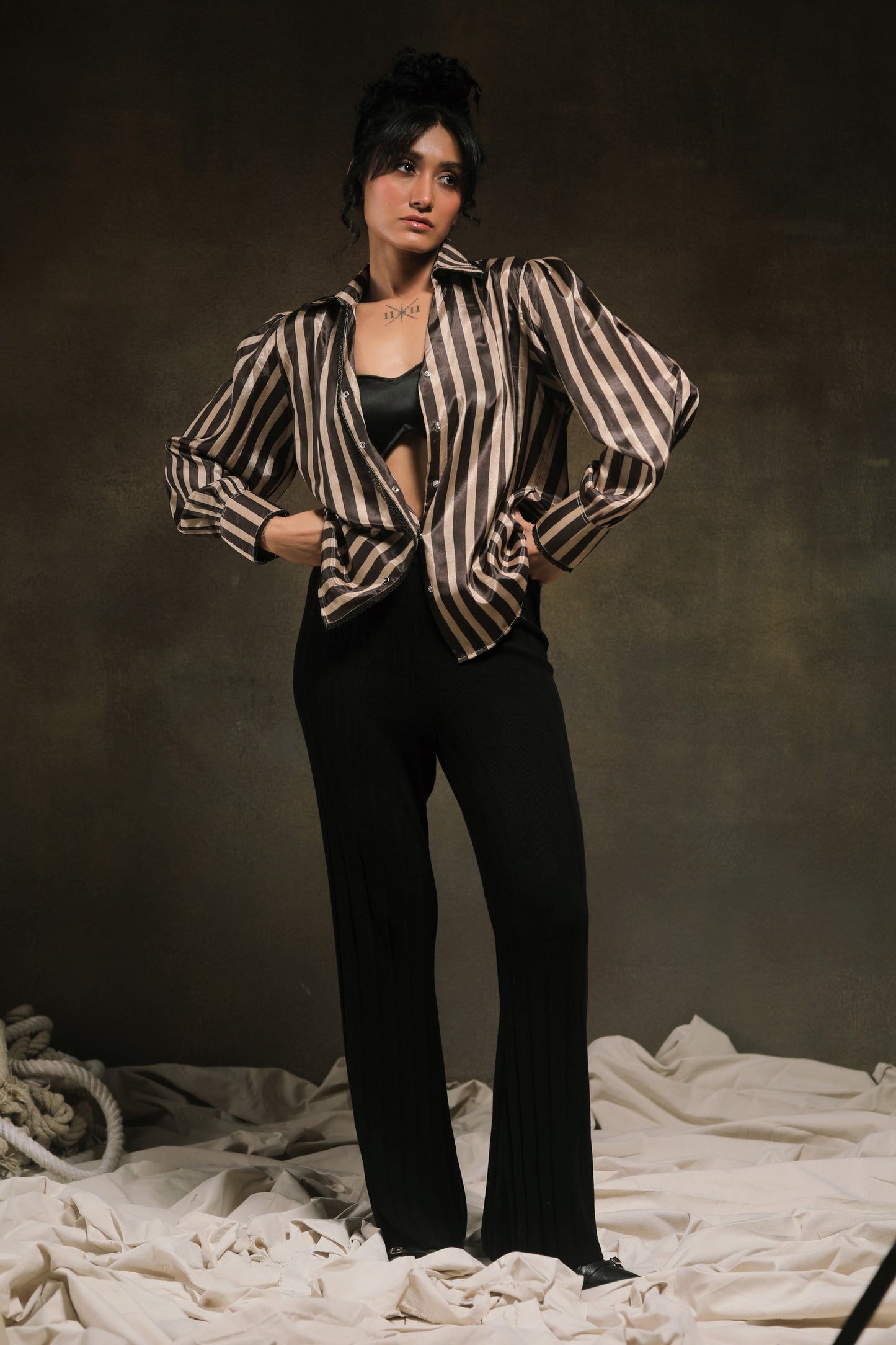 Oversized striped shirt by 66aura with blue and white horizontal stripes, featuring a relaxed fit and button-front design.