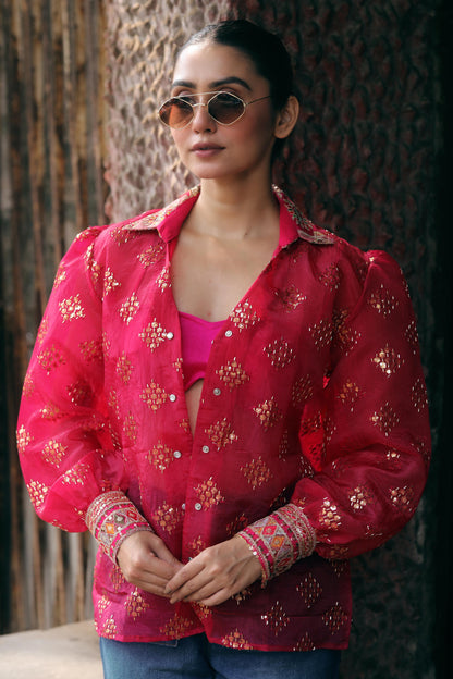 66aura drip district shirt displayed on a hanger with a modern, casual design and vibrant print.