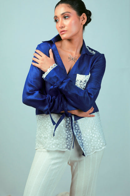 Cobalt crush oversized shirt by 66aura displayed on a hanger, featuring a relaxed fit and casual style in vibrant blue fabric.