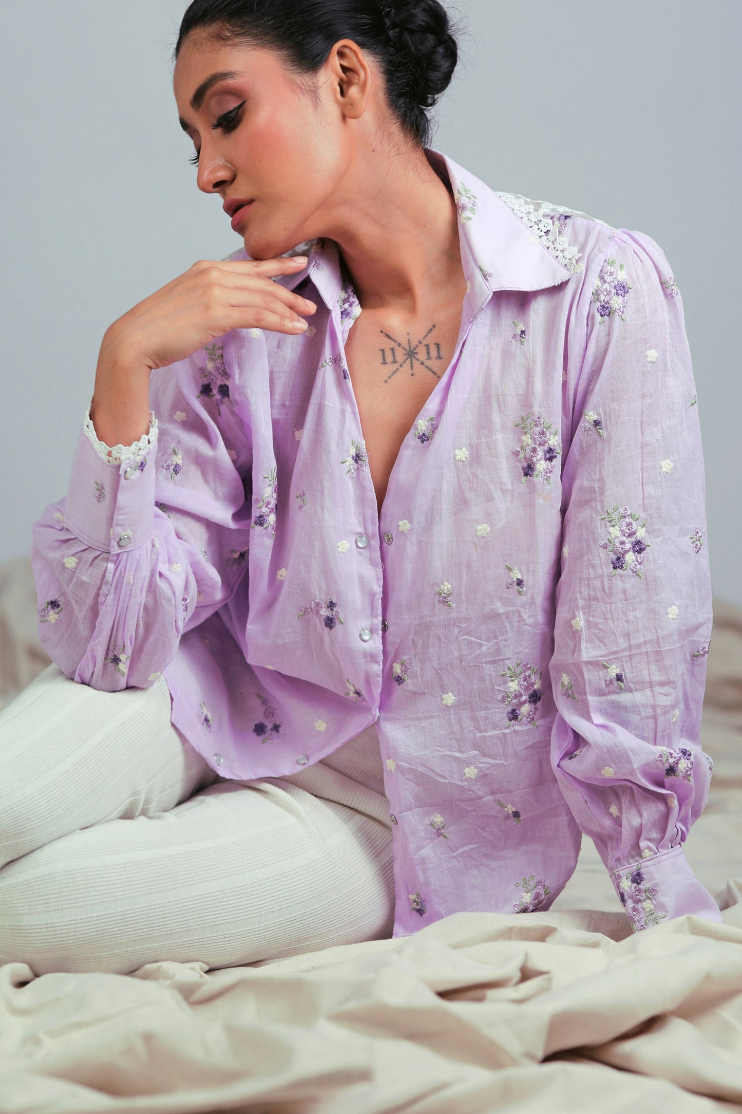 Lilac Lagoon oversized shirt by 66aura, showcasing a relaxed fit with soft fabric and pastel lilac color on a hanger.