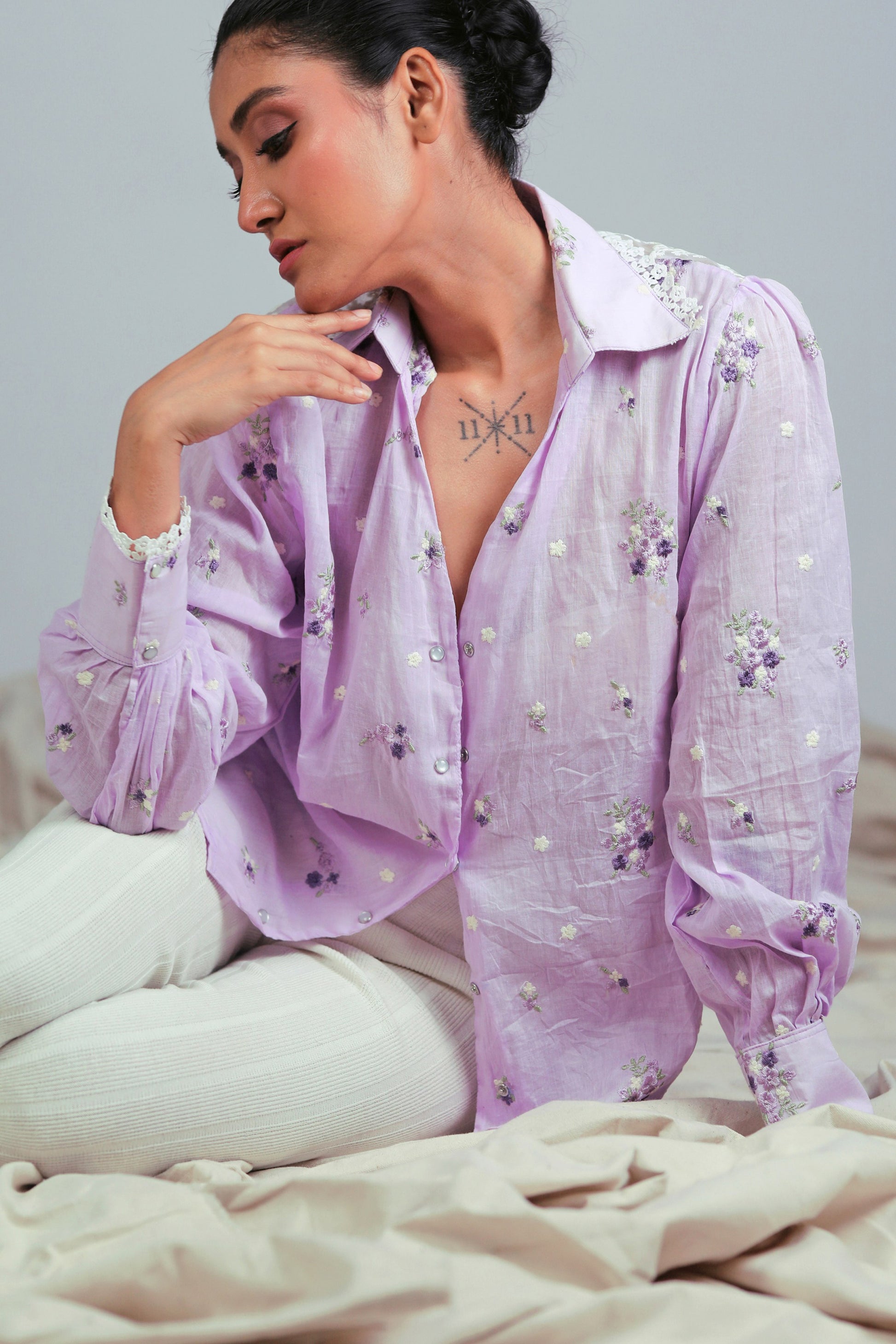 Lilac Lagoon oversized shirt by 66aura, showcasing a relaxed fit with soft fabric and pastel lilac color on a hanger.
