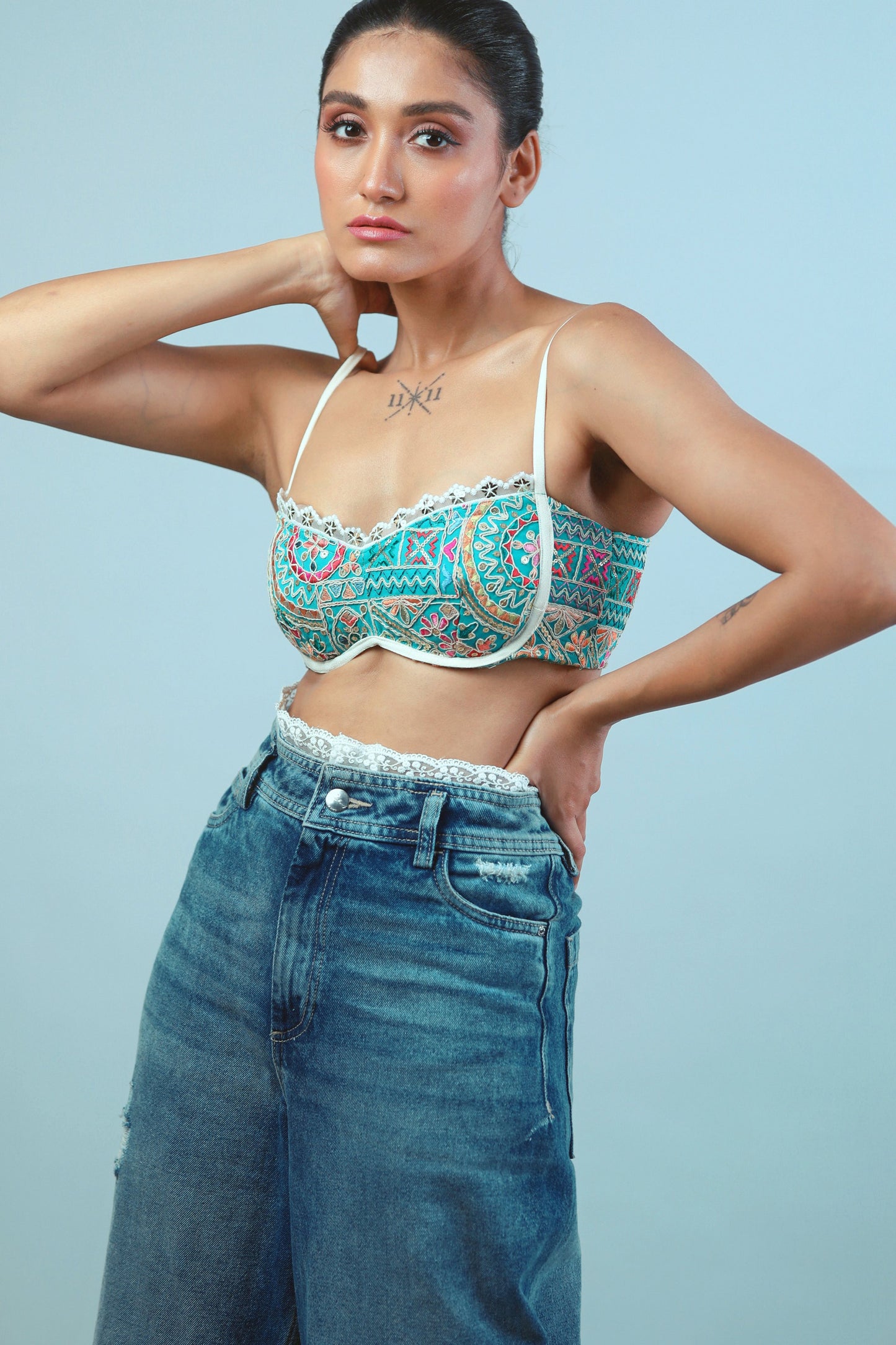 Confetti Cut Bralette by 66aura featuring a colorful, patterned design with soft fabric and adjustable straps.