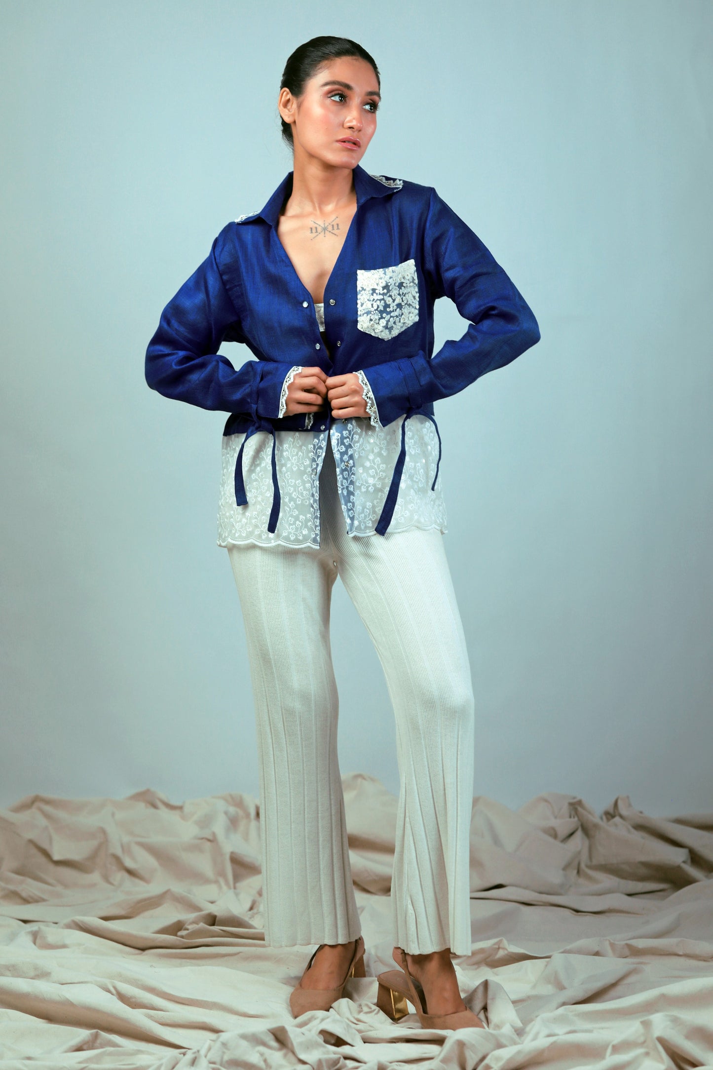 Cobalt crush oversized shirt by 66aura featuring a relaxed fit, button front, and long sleeves, displayed on a hanger.