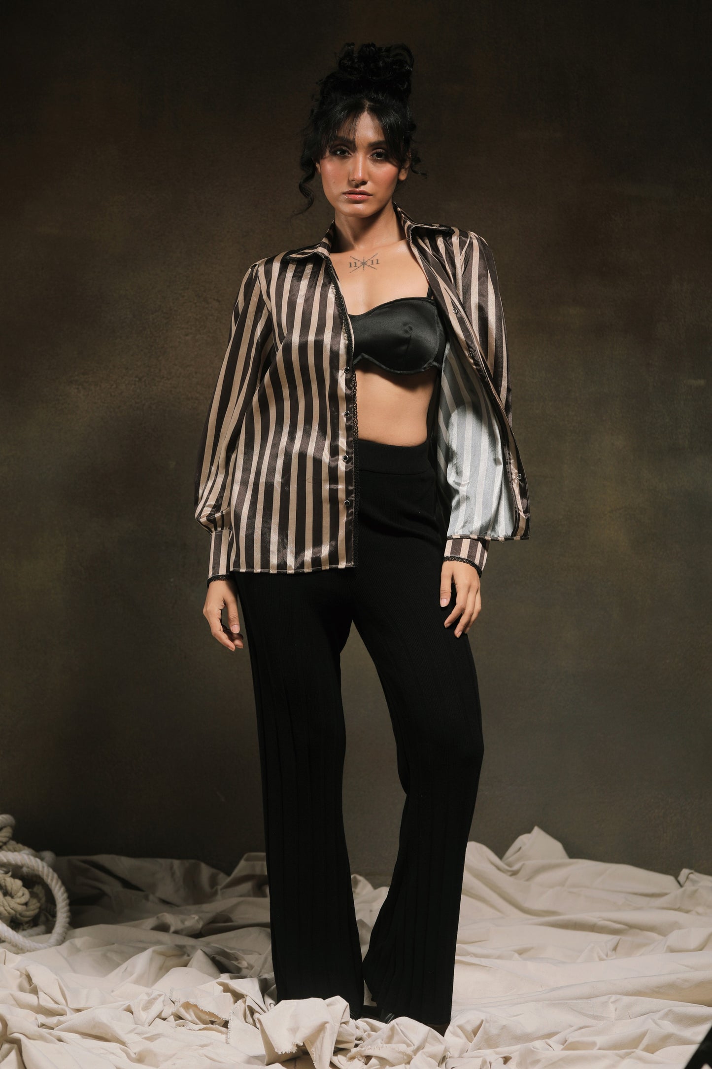 Oversized Stripe Spin Shirt by 66aura featuring bold vertical black and white stripes and a relaxed fit.