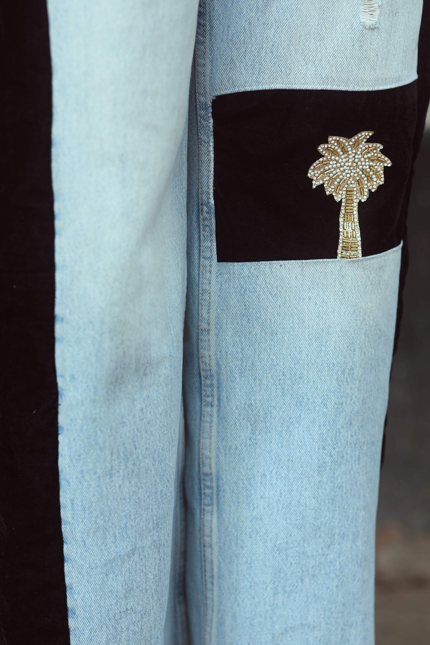 66aura boss babe jeans featuring high-waisted design, distressed denim, and classic five-pocket styling on a model.