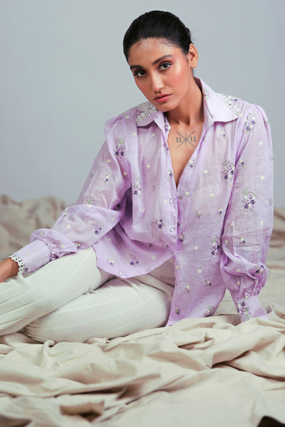 Light purple oversized shirt from 66aura featuring a relaxed fit and casual design, shown on a mannequin.