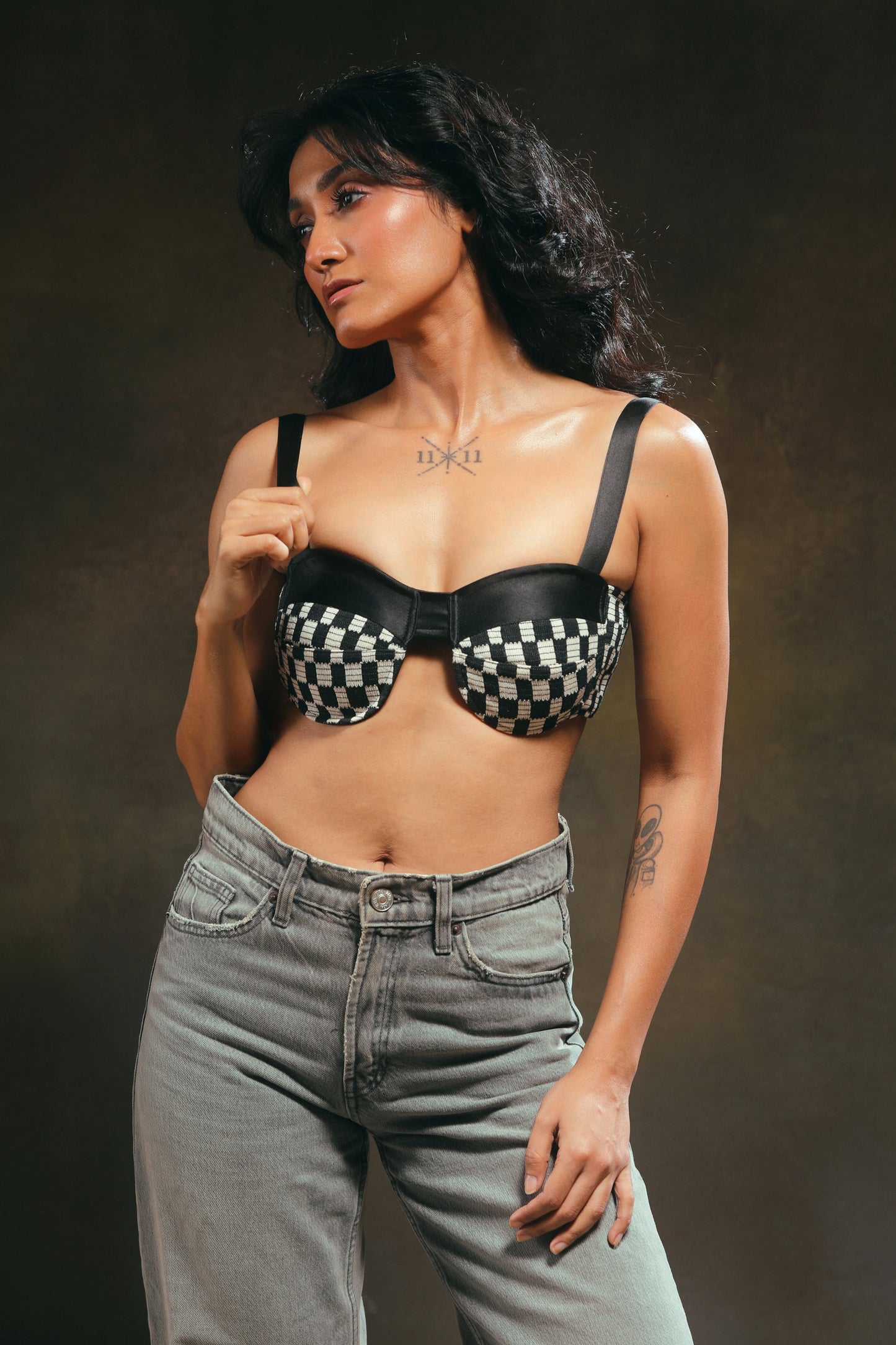 66aura Cubicle Crush Bralette featuring lace details and adjustable straps, shown on a model.