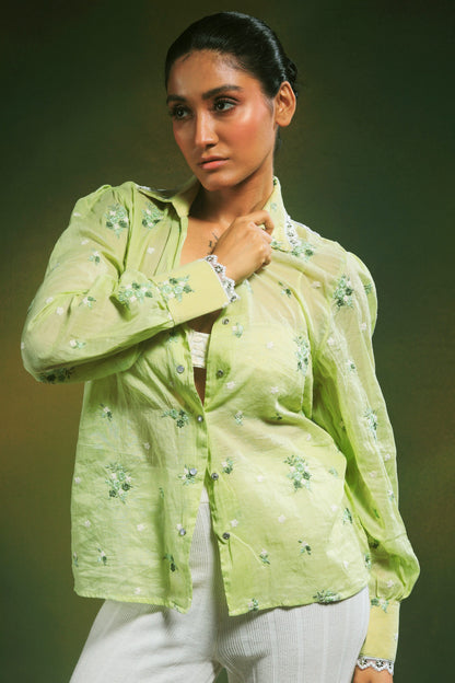 Mint Mist oversized shirt by 66aura displayed on a hanger, showcasing its relaxed fit and soft mint green fabric.