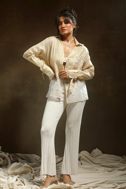 TAN Twist oversized shirt by 66aura, featuring a relaxed fit and twisted front design, displayed on a hanger.