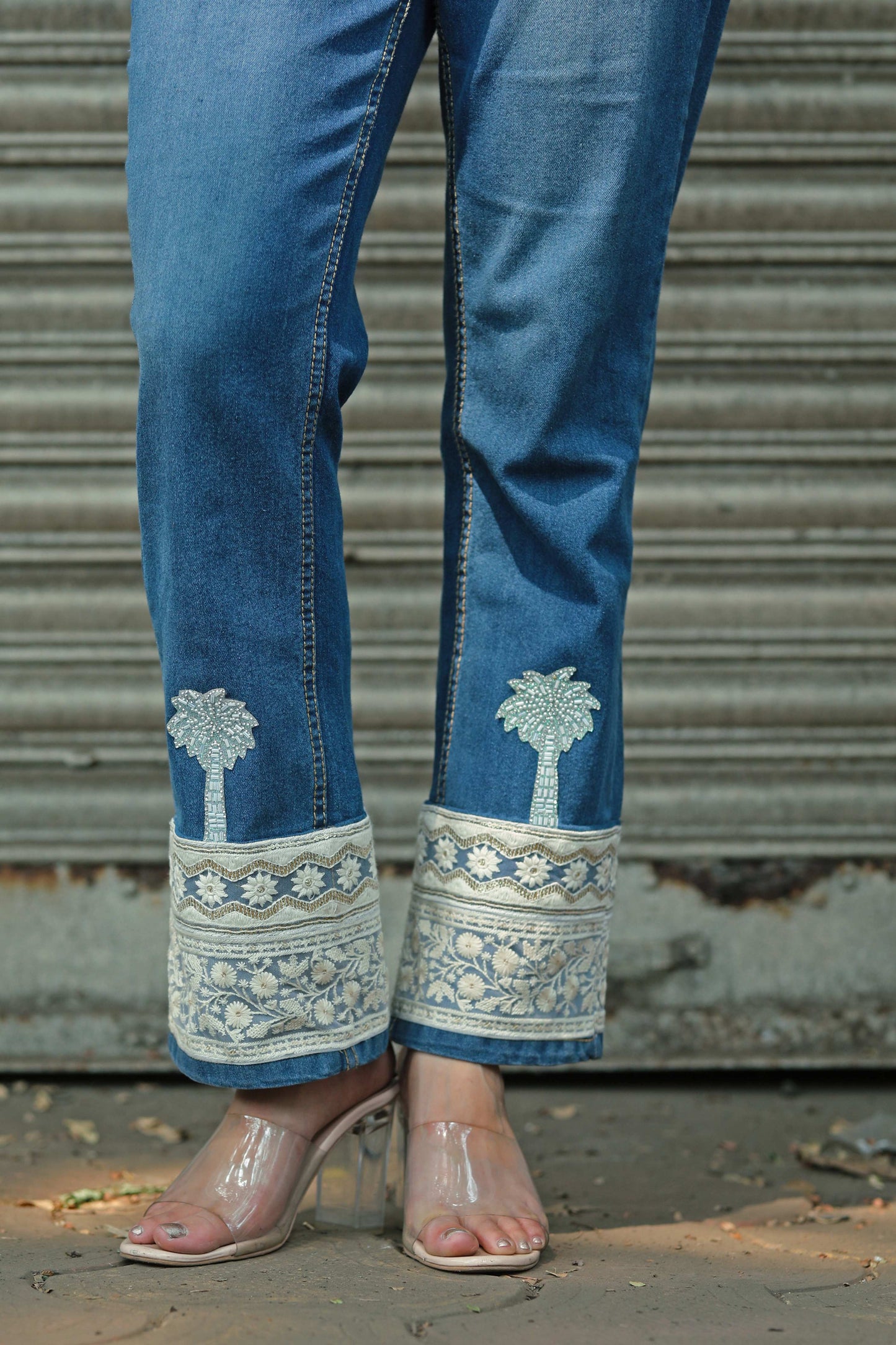 Hot Mess jeans by 66aura featuring distressed denim and a relaxed fit, shown on a model with casual styling.