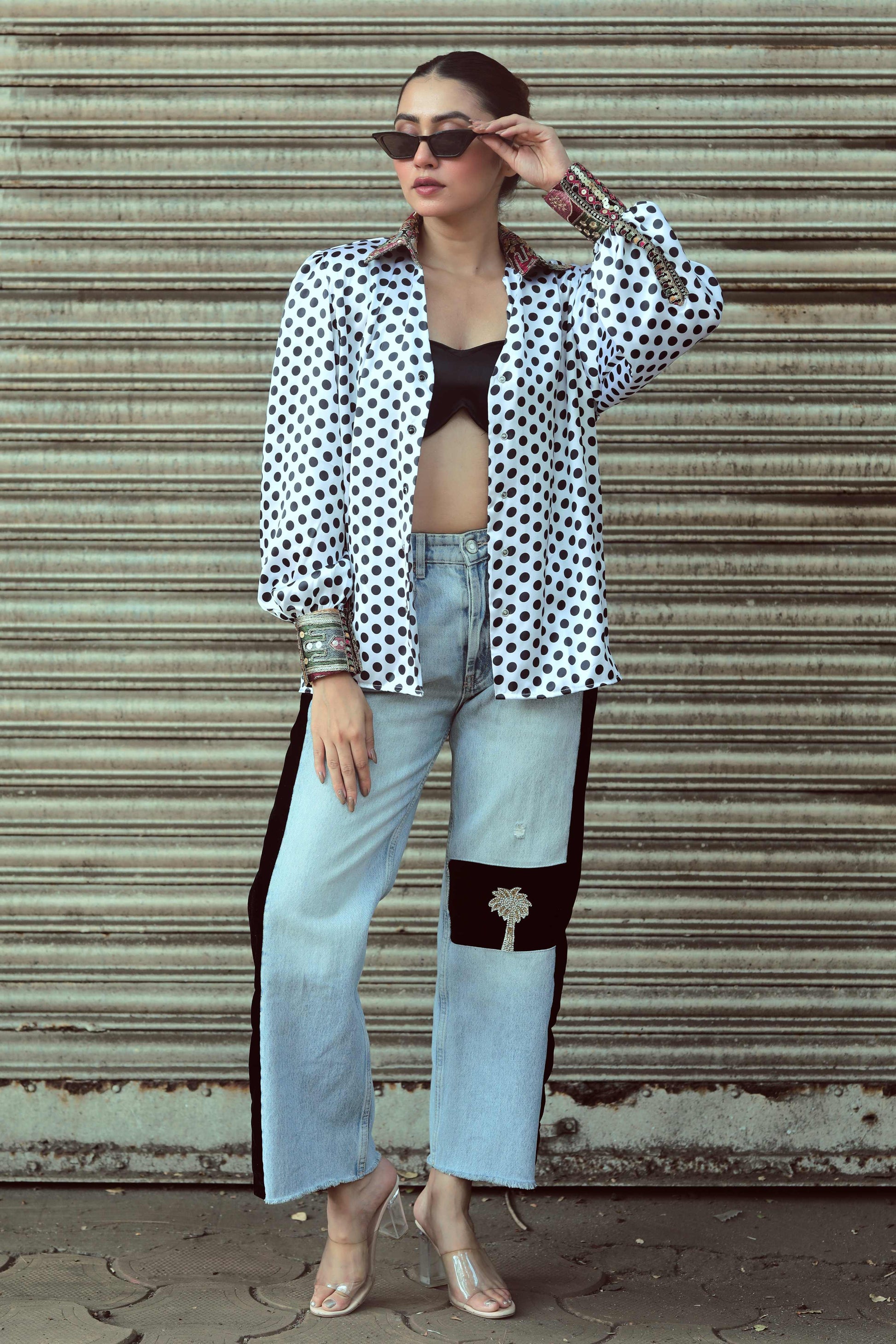 Close-up of the 66aura Plot Twist shirt featuring a graphic design with bold text and vibrant colors on soft fabric.