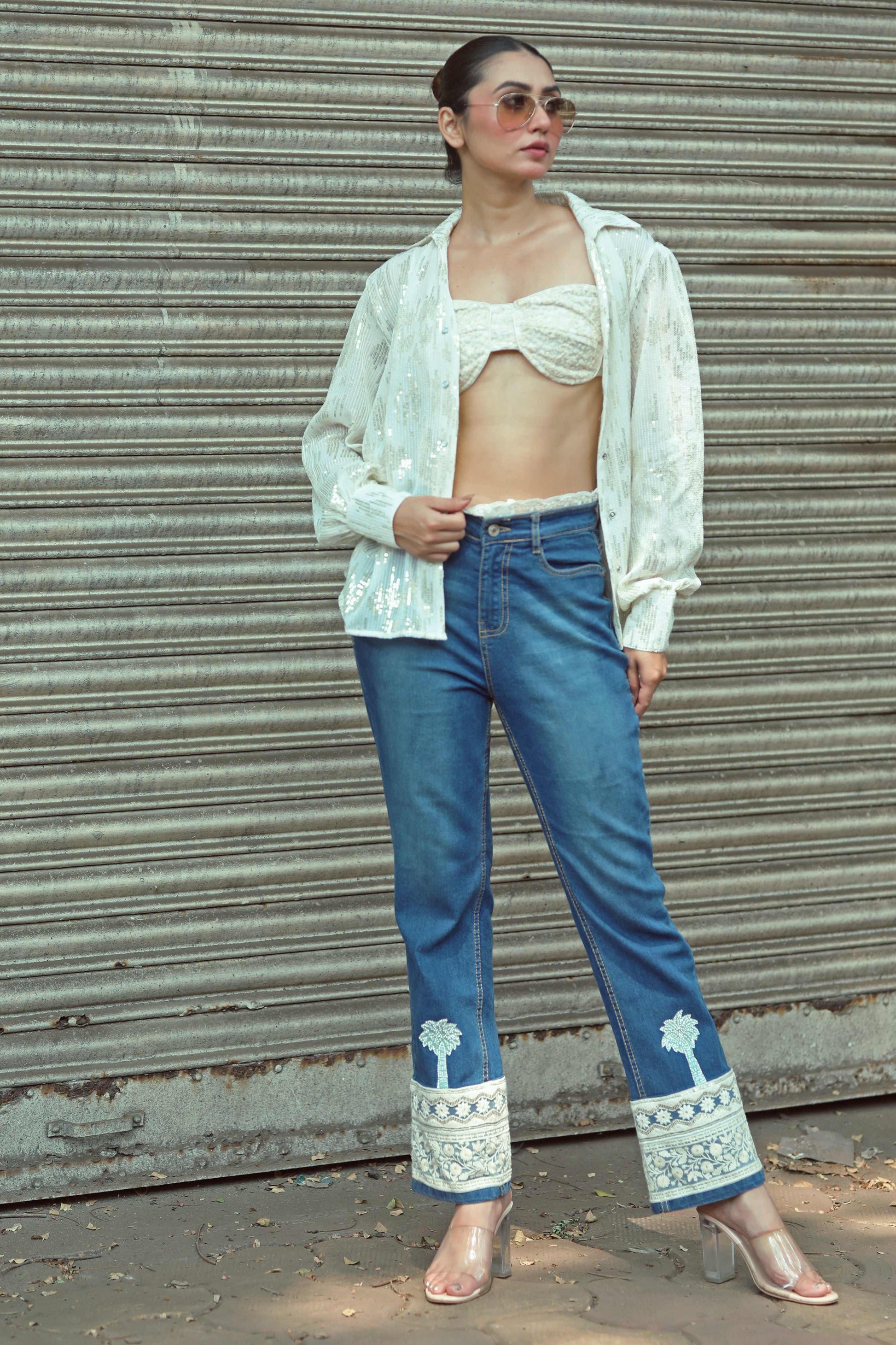 Hot Mess jeans by 66aura featuring distressed denim, high-waisted fit, and stylish rips on the front.