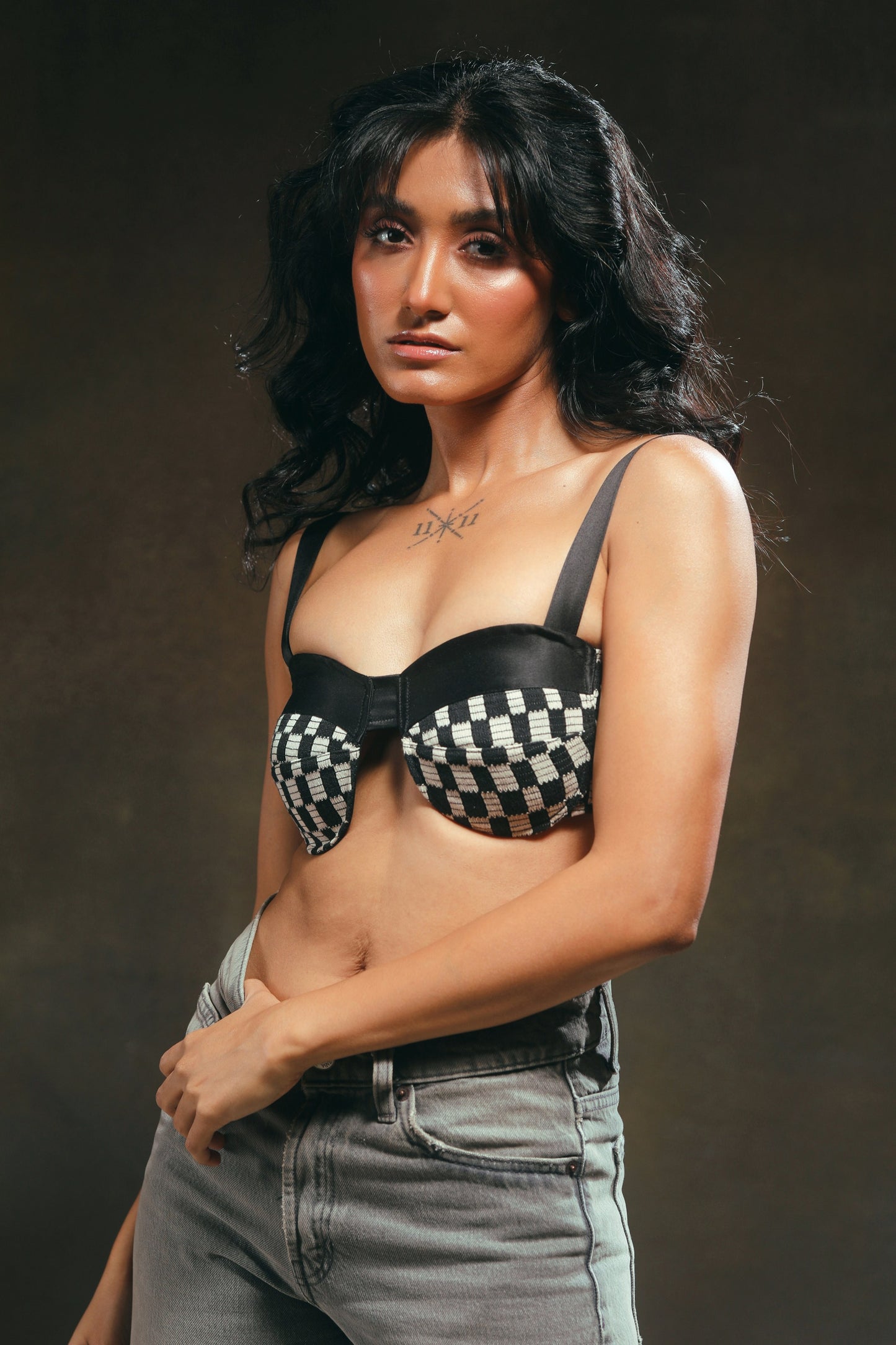 66aura Cubicle Crush Bralette with delicate lace design and adjustable straps, shown on a model.