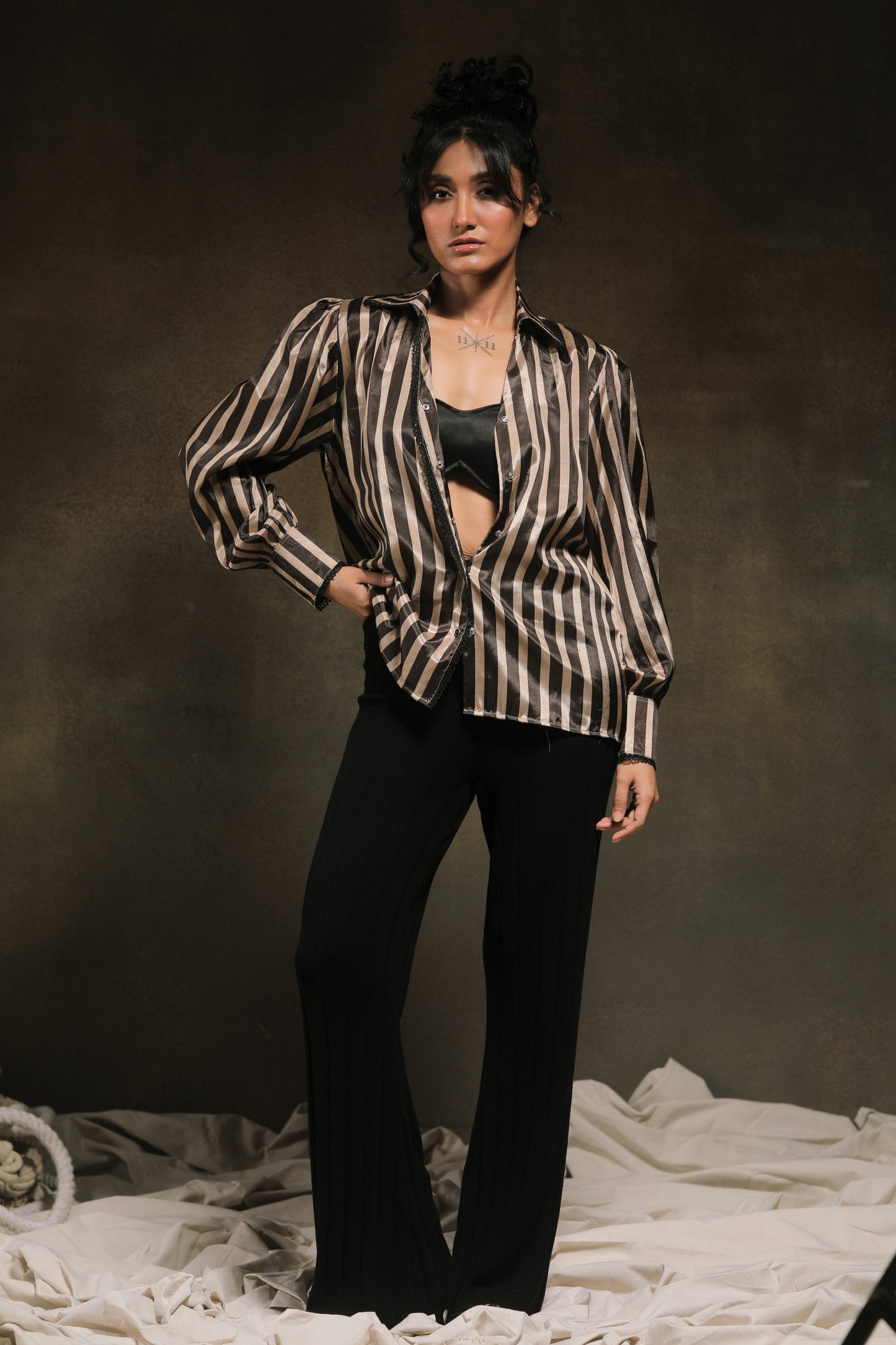 Oversized Stripe Spin shirt by 66aura featuring a relaxed fit, bold horizontal stripes, and a casual, comfortable design.