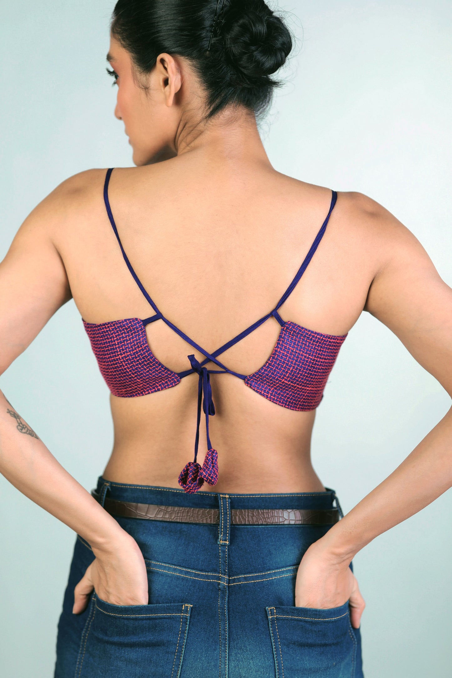 66aura Breezy Bureau Bralette in soft fabric with adjustable straps and delicate lace details, displayed on a neutral background.