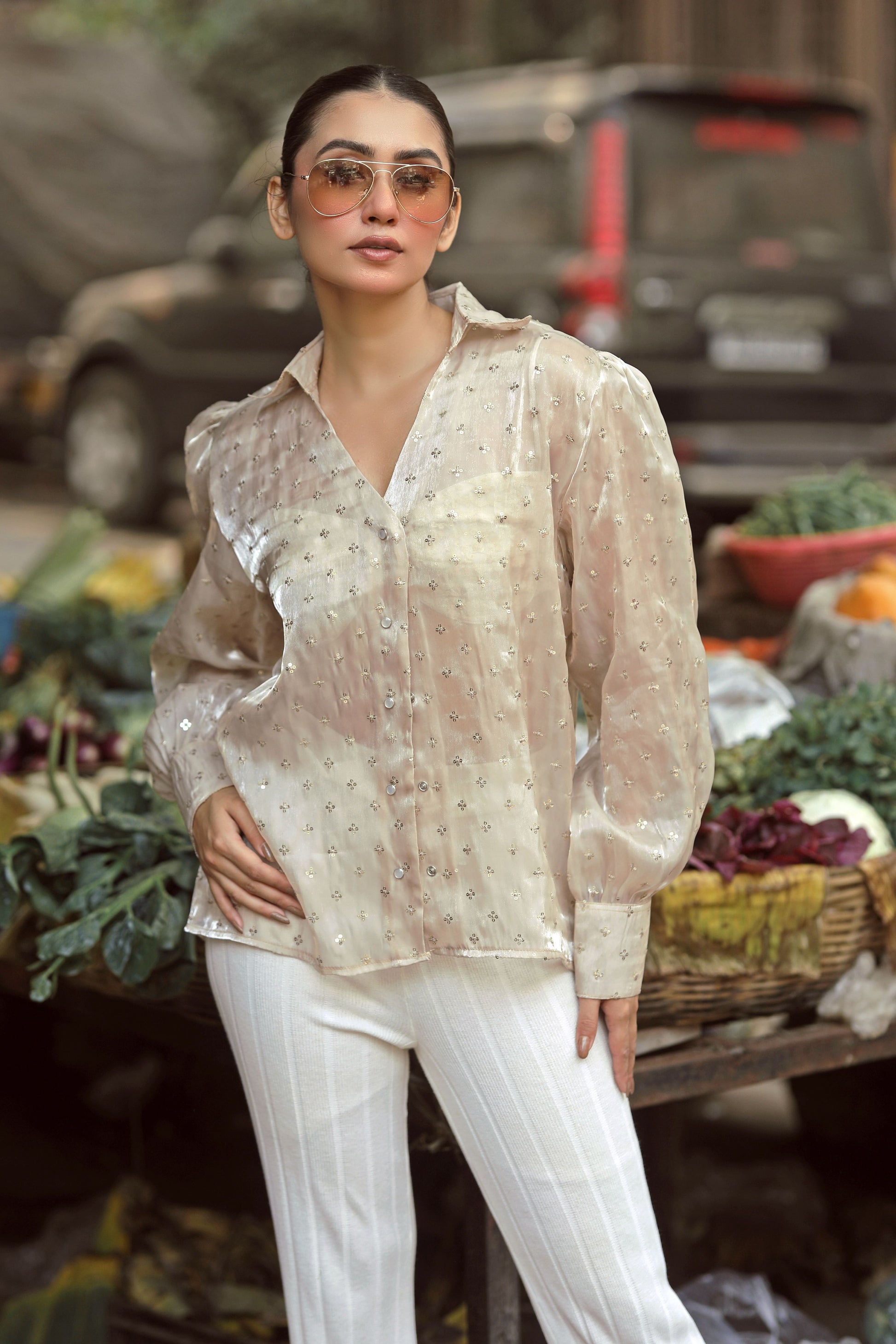 Black LOUD LUXURY shirt by 66aura displayed on a hanger, featuring a stylish design with a relaxed fit.