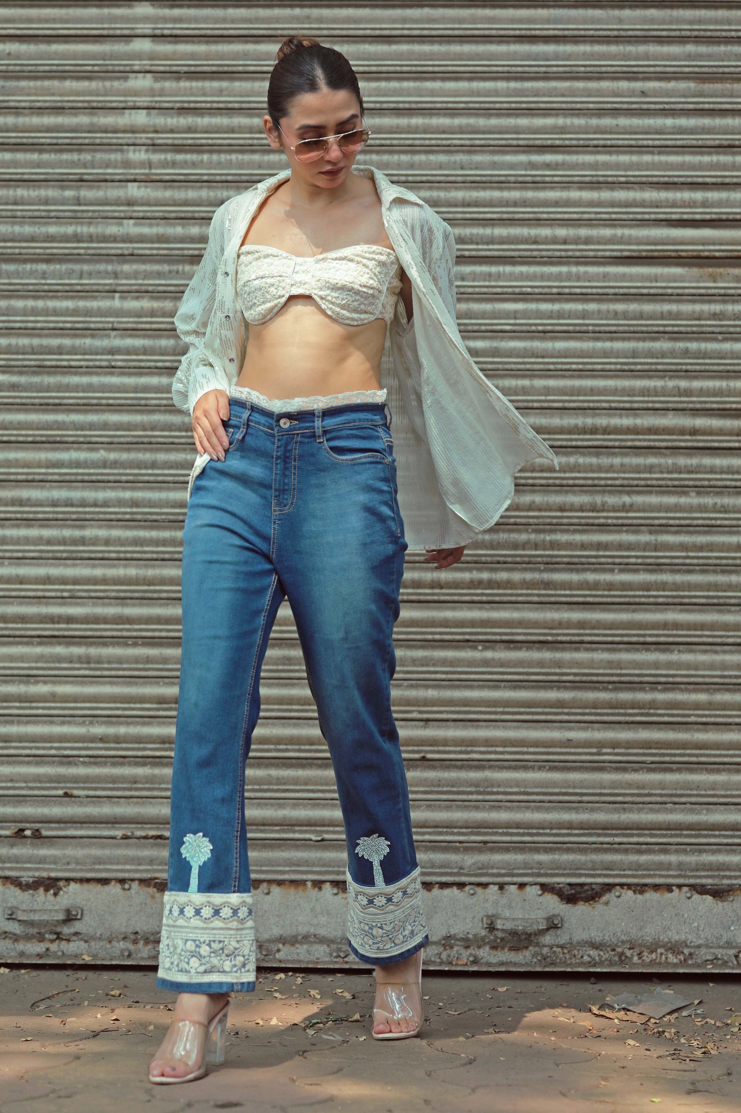 Hot Mess jeans by 66aura, showing distressed denim with a high waist and ripped details, styled for a casual look.