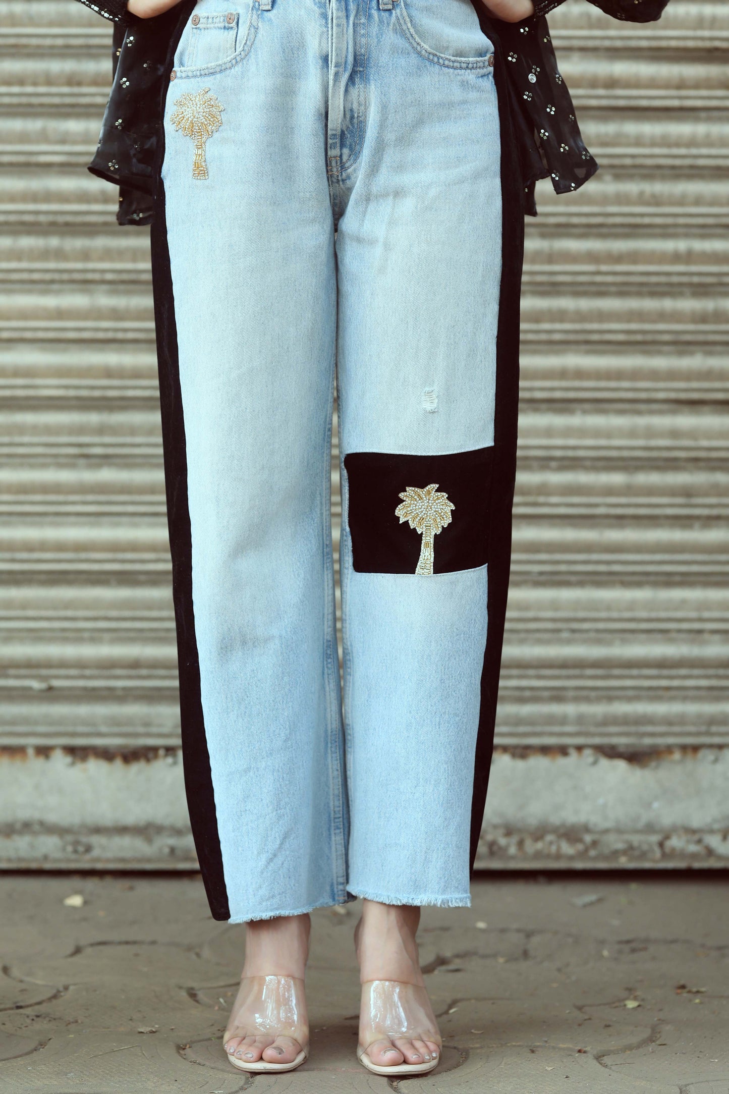 Pair of stylish BOSS BABE jeans by 66aura featuring a classic blue denim fit and trendy high-waist design.