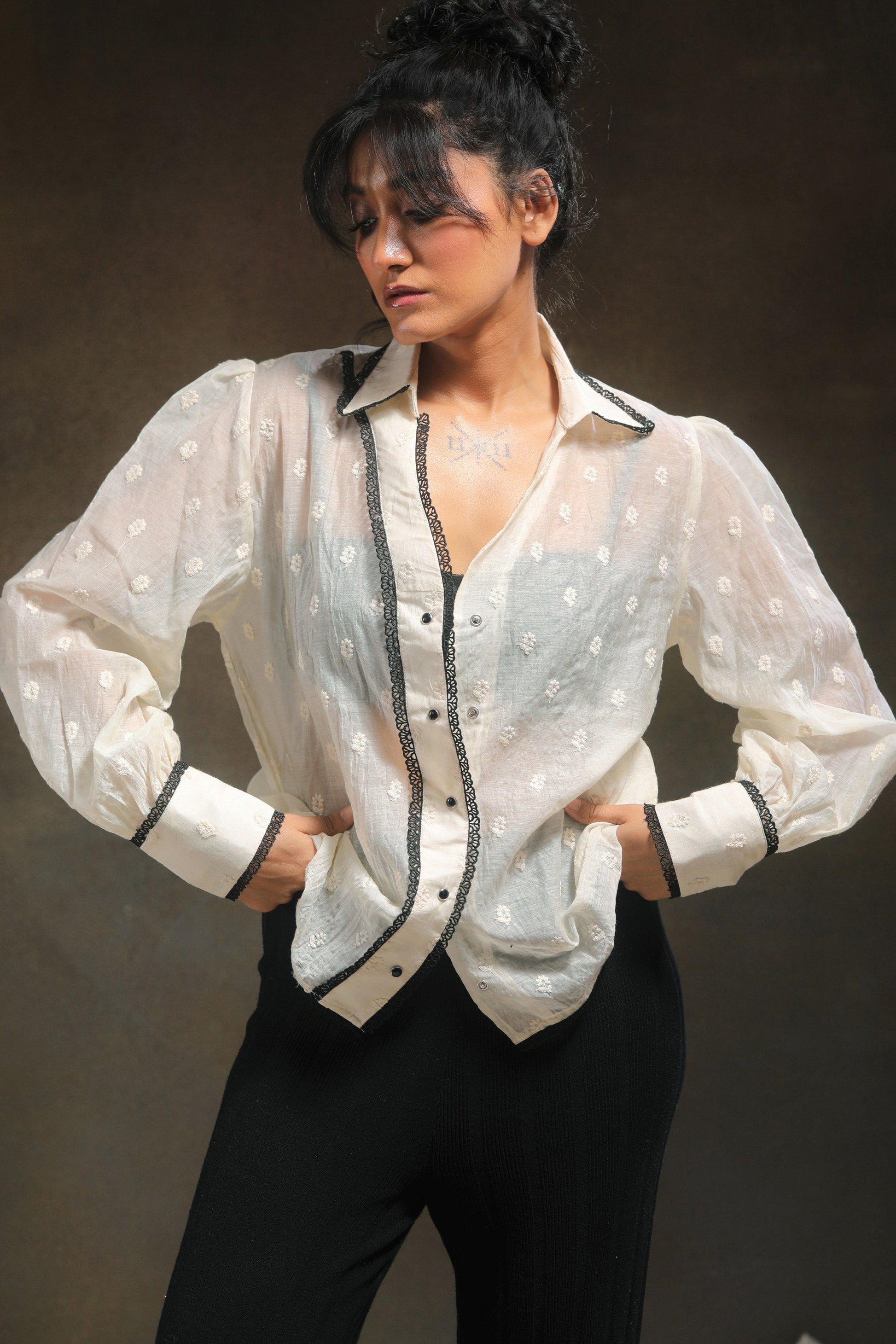 Oversized Blink Blink shirt by 66aura, featuring a relaxed fit with bold graphic design and soft fabric, worn casually.