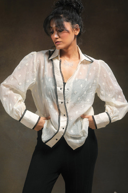 Oversized Blink Blink shirt by 66aura, featuring a relaxed fit with bold graphic design and soft fabric, worn casually.