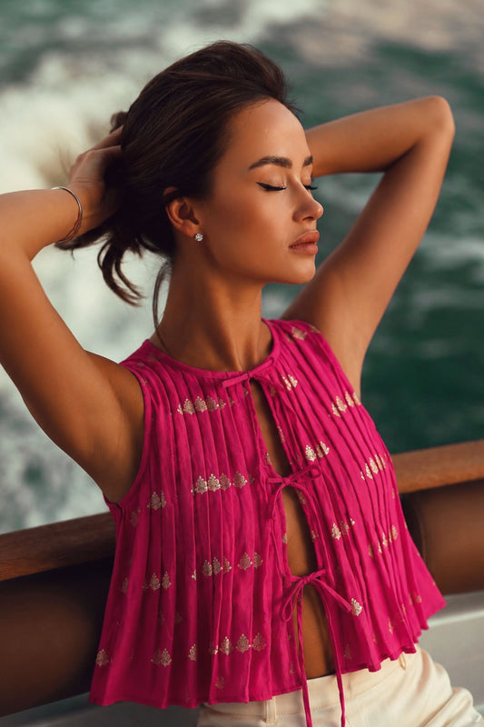 66aura Bellagio Babe Top front view showing flowy fabric, sleeveless design, and stylish neckline.