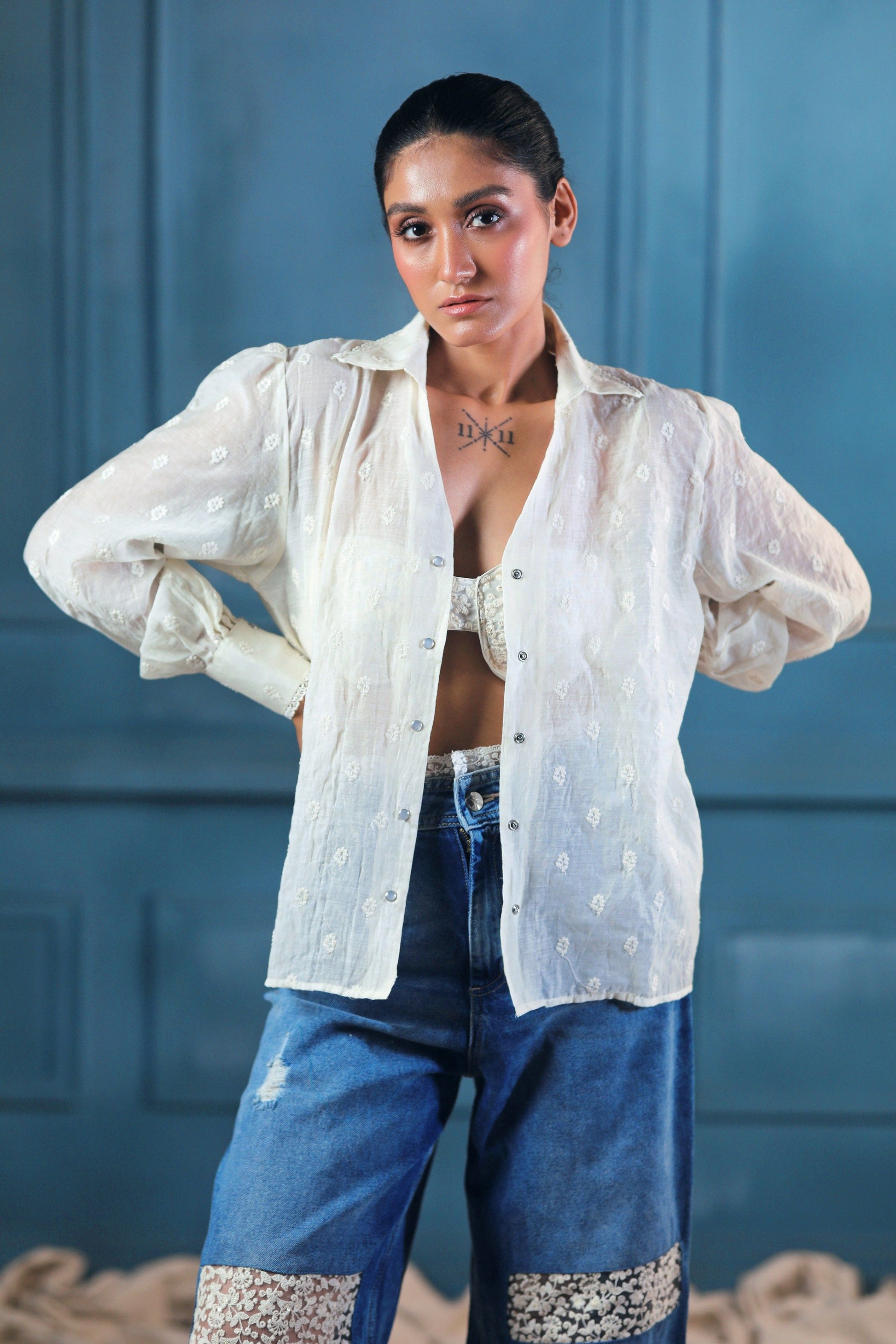 Light blue oversized CLOUD CRAFT shirt by 66aura displayed on a hanger, showcasing its relaxed fit and soft fabric.