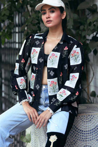 66aura VIBE CHECK shirt, casual button-up with vibrant pattern, shown on a hanger against a neutral background.