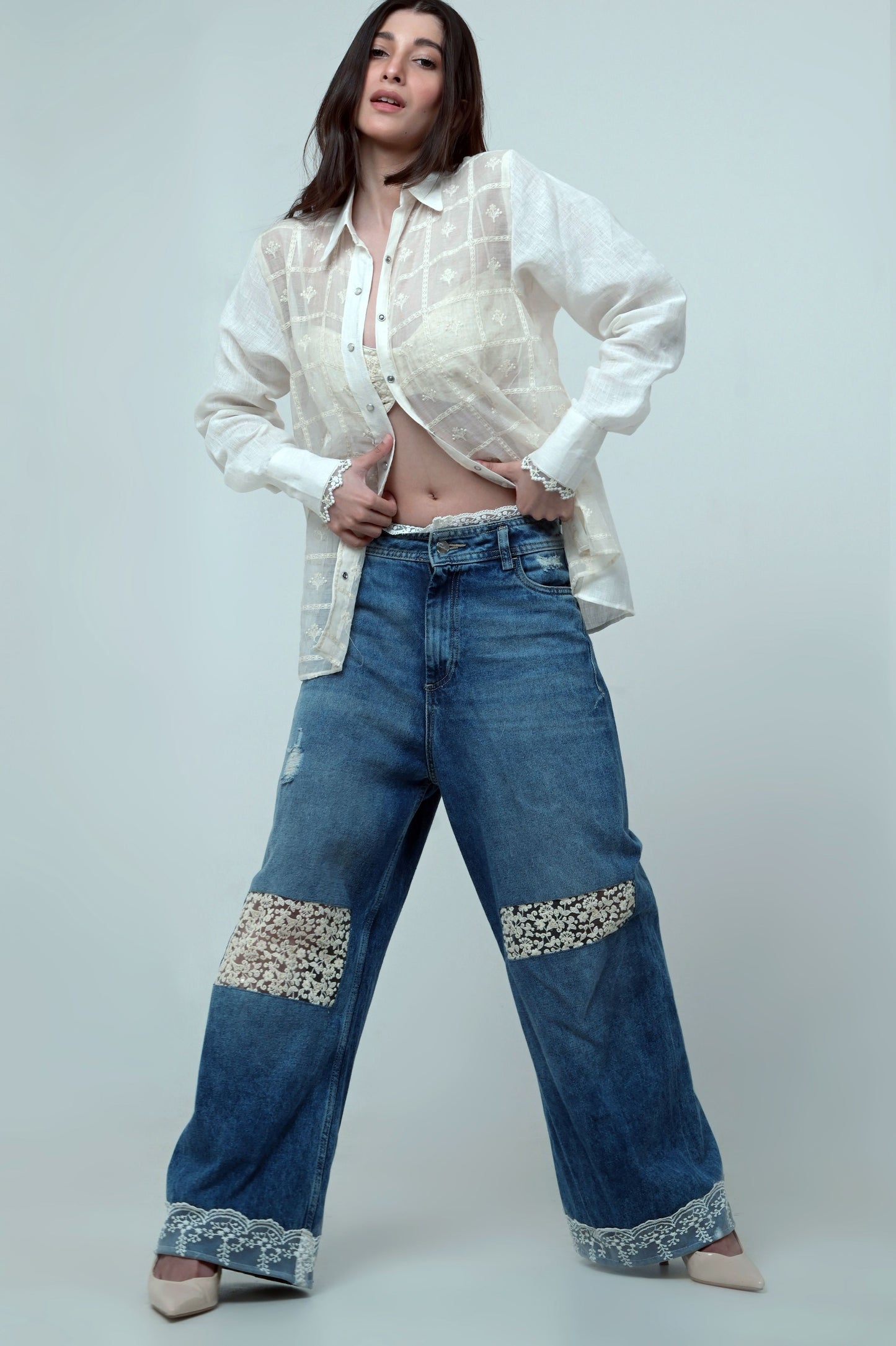 66aura VIBE CHECK jeans shown in black with distressed details and a relaxed fit, perfect for casual streetwear style.