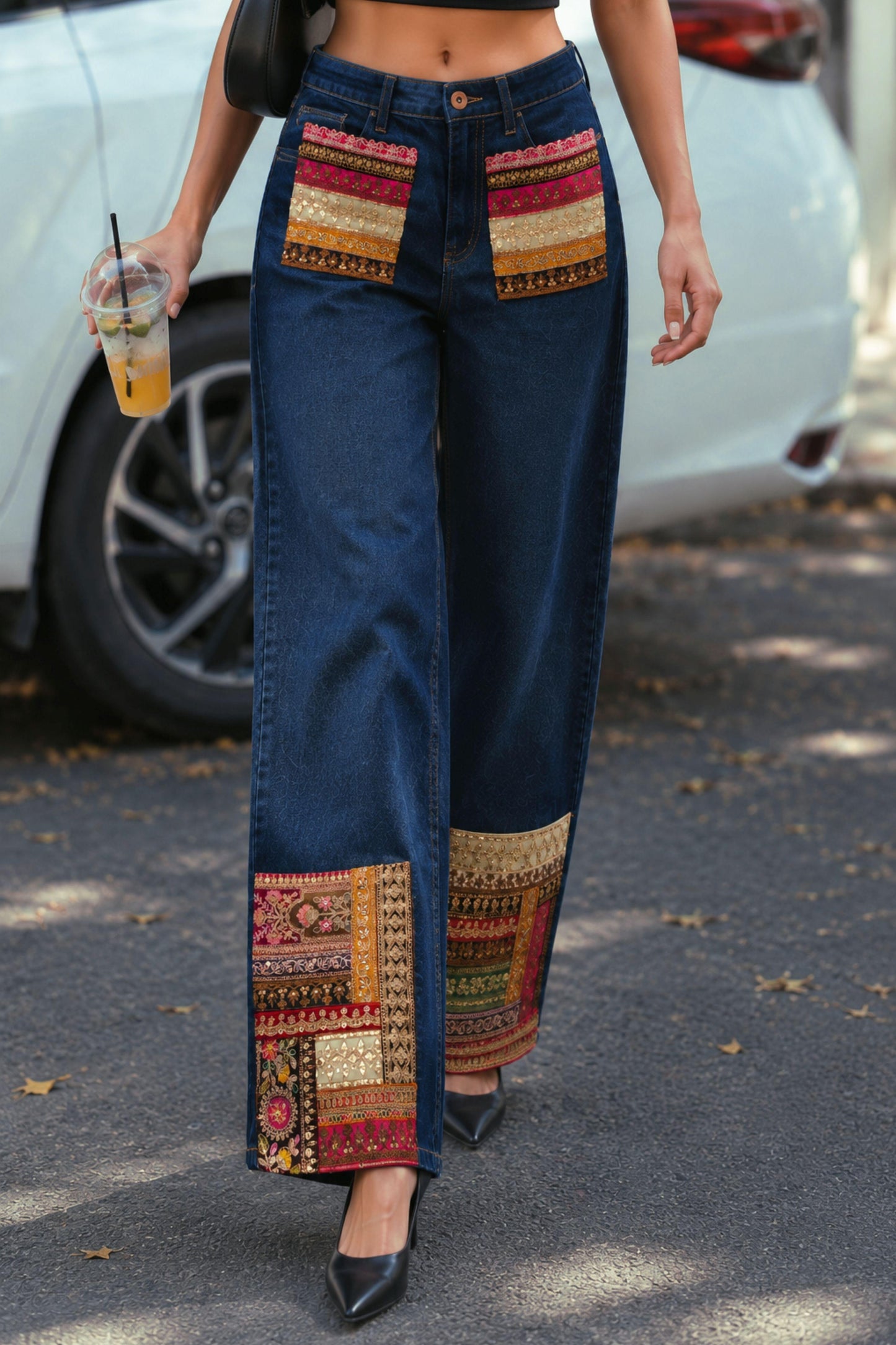 Pair of 66aura Too Iconic jeans showing classic denim wash, slim fit design, and detailed stitching on a white background.