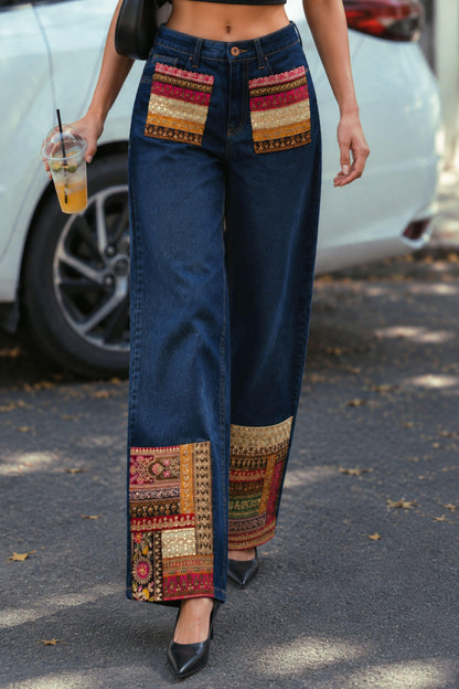 Pair of 66aura Too Iconic jeans showing classic denim wash, slim fit design, and detailed stitching on a white background.