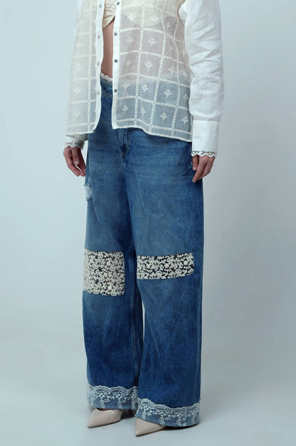 Dark blue Vibe Check jeans by 66aura displayed on a hanger, showcasing the slim fit design and classic five-pocket style.