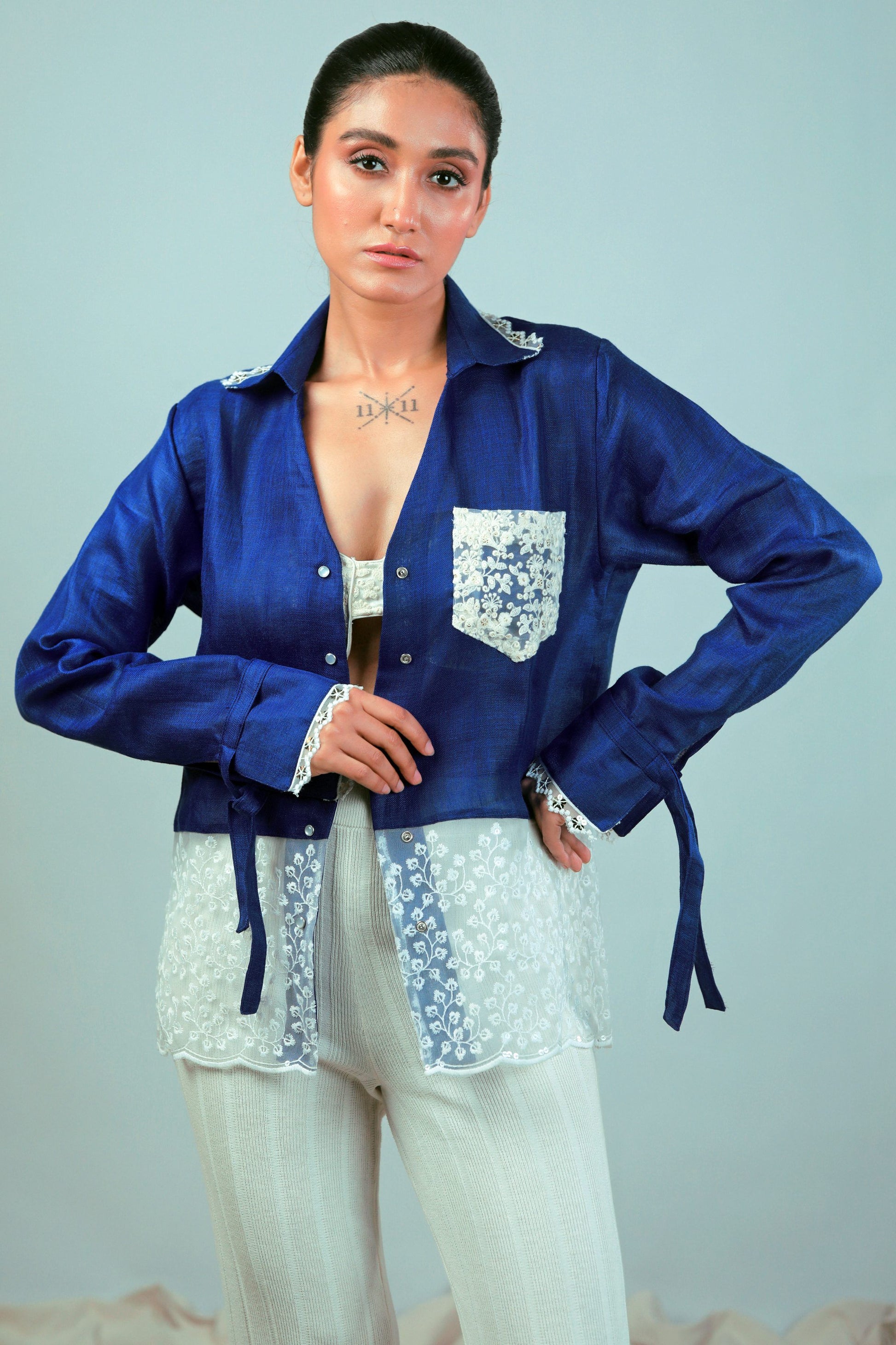 Cobalt crush oversized shirt by 66aura displayed on a hanger, featuring a relaxed fit and vibrant blue color.