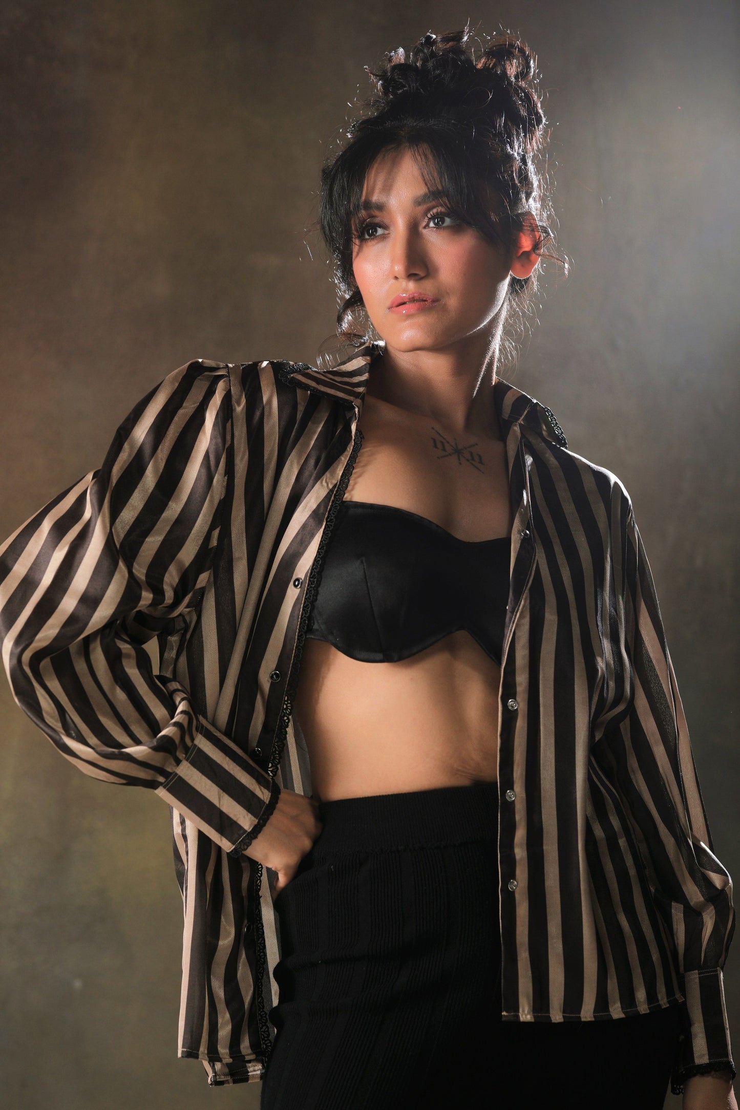 Oversized striped shirt by 66aura featuring bold horizontal stripes and a relaxed fit, shown on a model.