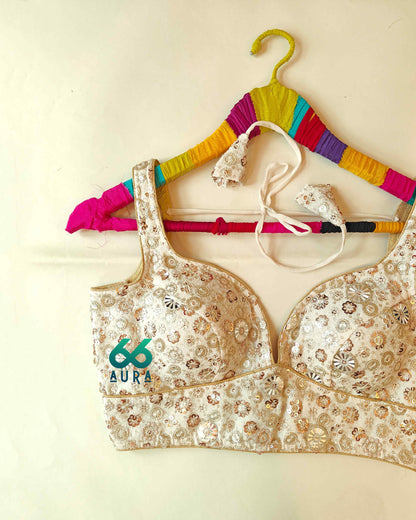 GLAM AURA SLEEVELESS BLOUSE