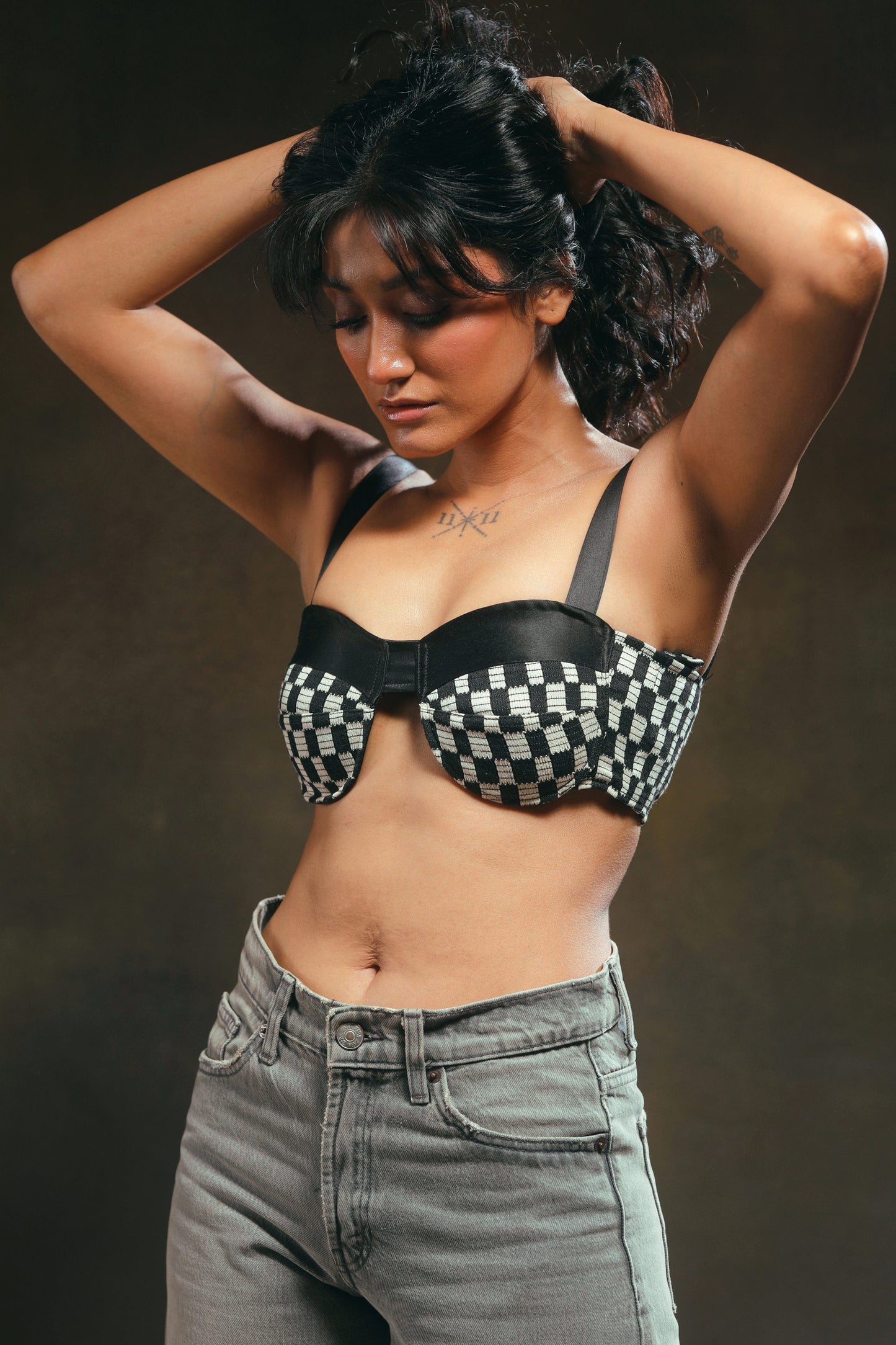 66aura Cubicle Crush Bralette in black, featuring soft fabric and delicate straps, displayed on a mannequin.