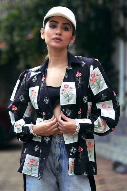 66aura VIBE CHECK shirt featuring a casual, stylish design with a vibrant pattern and classic fit, displayed on a hanger.