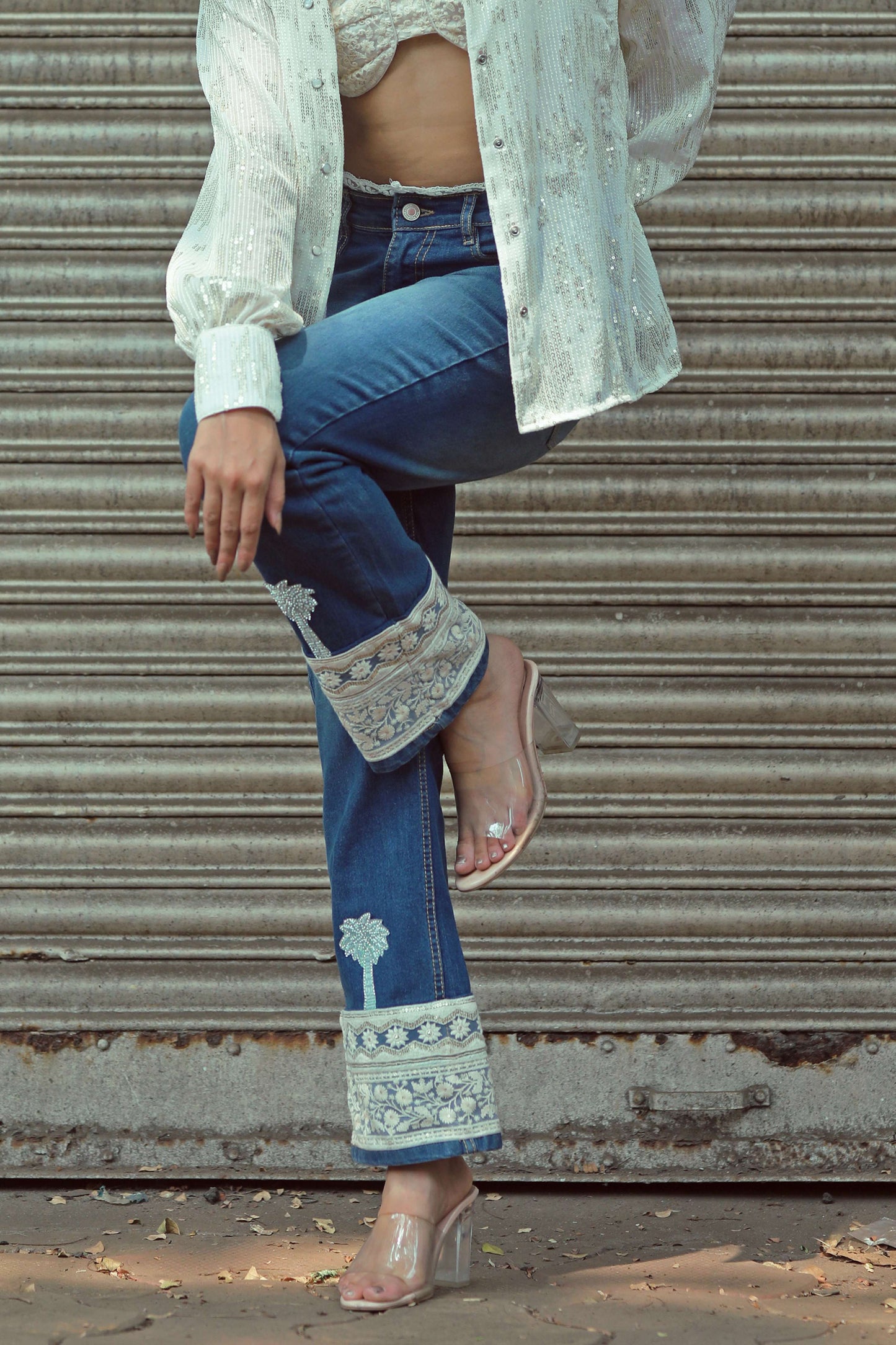 Pair of HOT MESS jeans by 66aura featuring distressed denim and a slim fit, shown on a model.