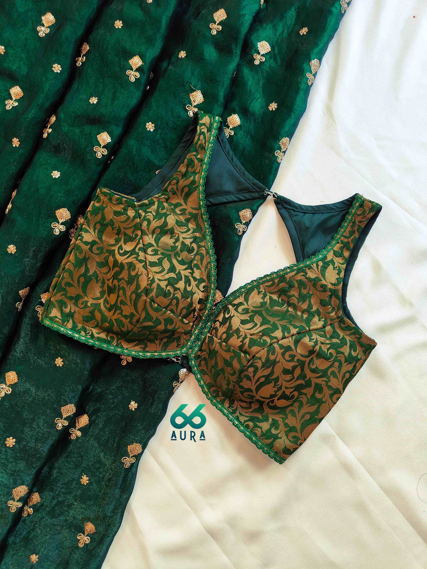 EMERALD AURA SLEEVELESS BLOUSE