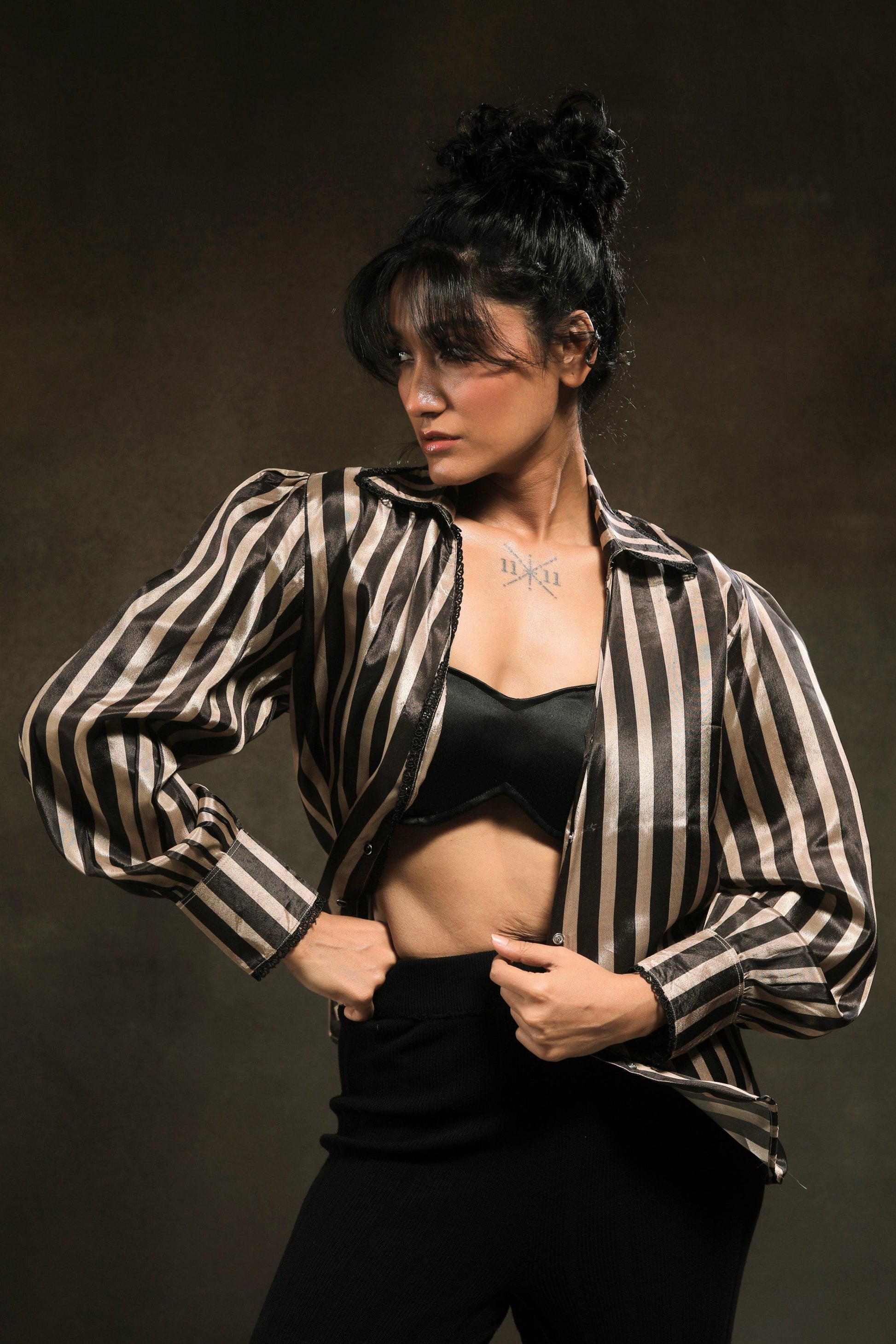 Oversized striped shirt by 66aura featuring bold vertical stripes and a relaxed fit, displayed on a model.