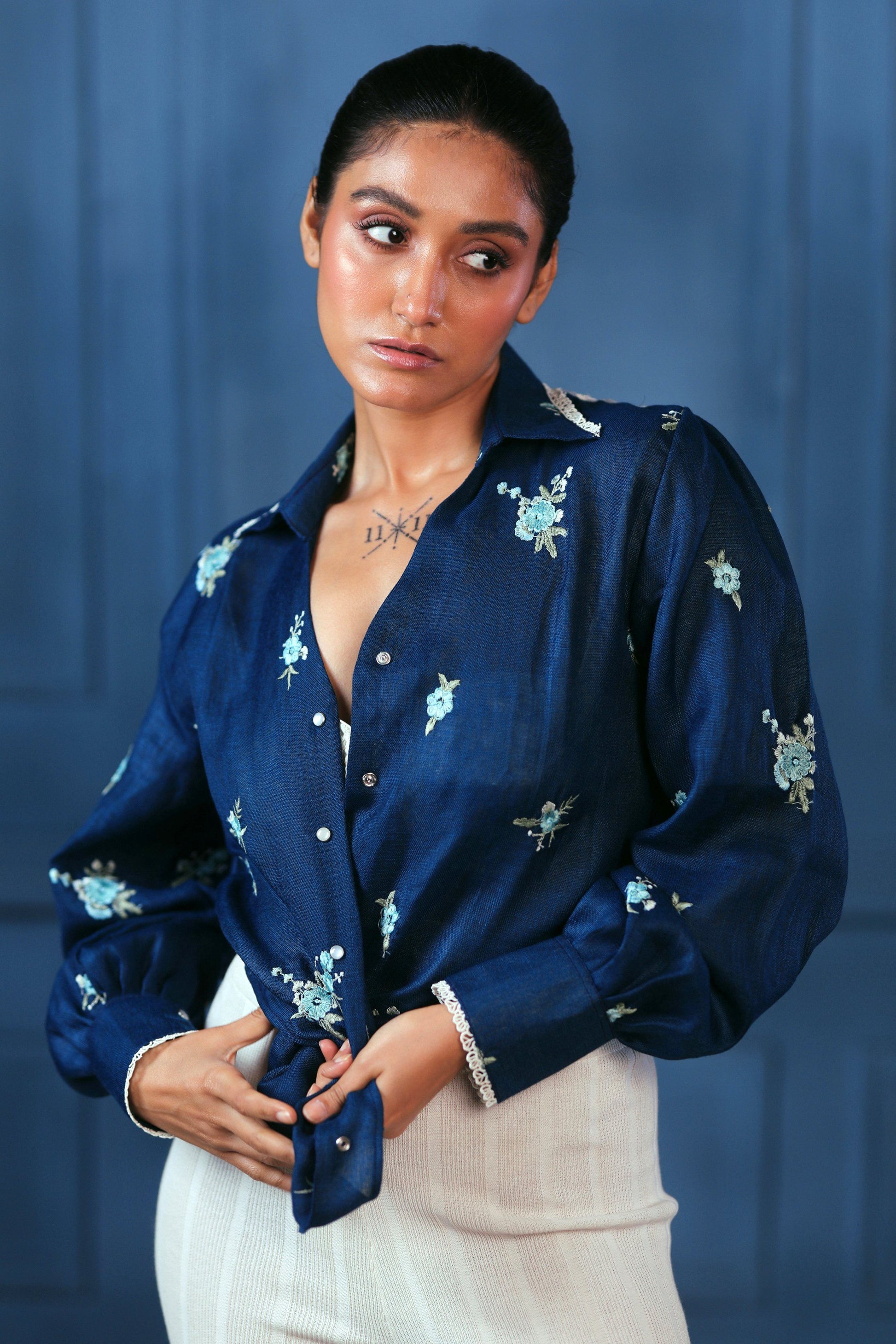 Navy Nexus oversized shirt by 66aura, featuring a relaxed fit and soft fabric, displayed on a hanger.