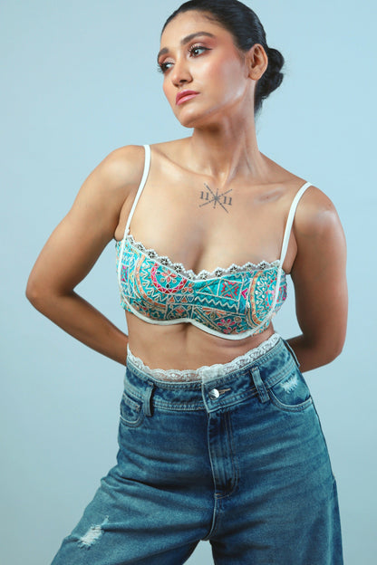 Confetti Cut Bralette by 66aura featuring colorful confetti design and soft fabric, front view showing adjustable straps and vibrant pattern.