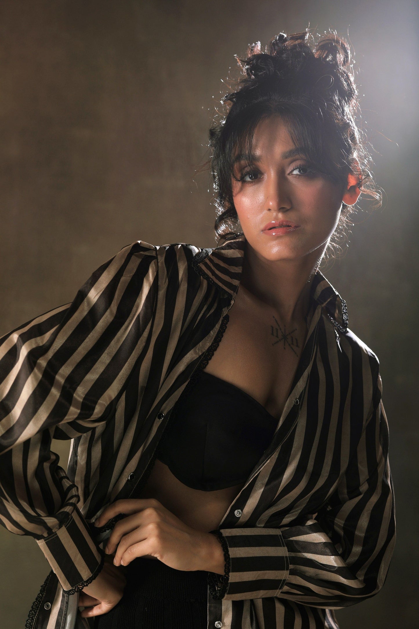 Oversized stripe shirt by 66aura featuring bold blue and white vertical stripes, relaxed fit, and classic button-down design.