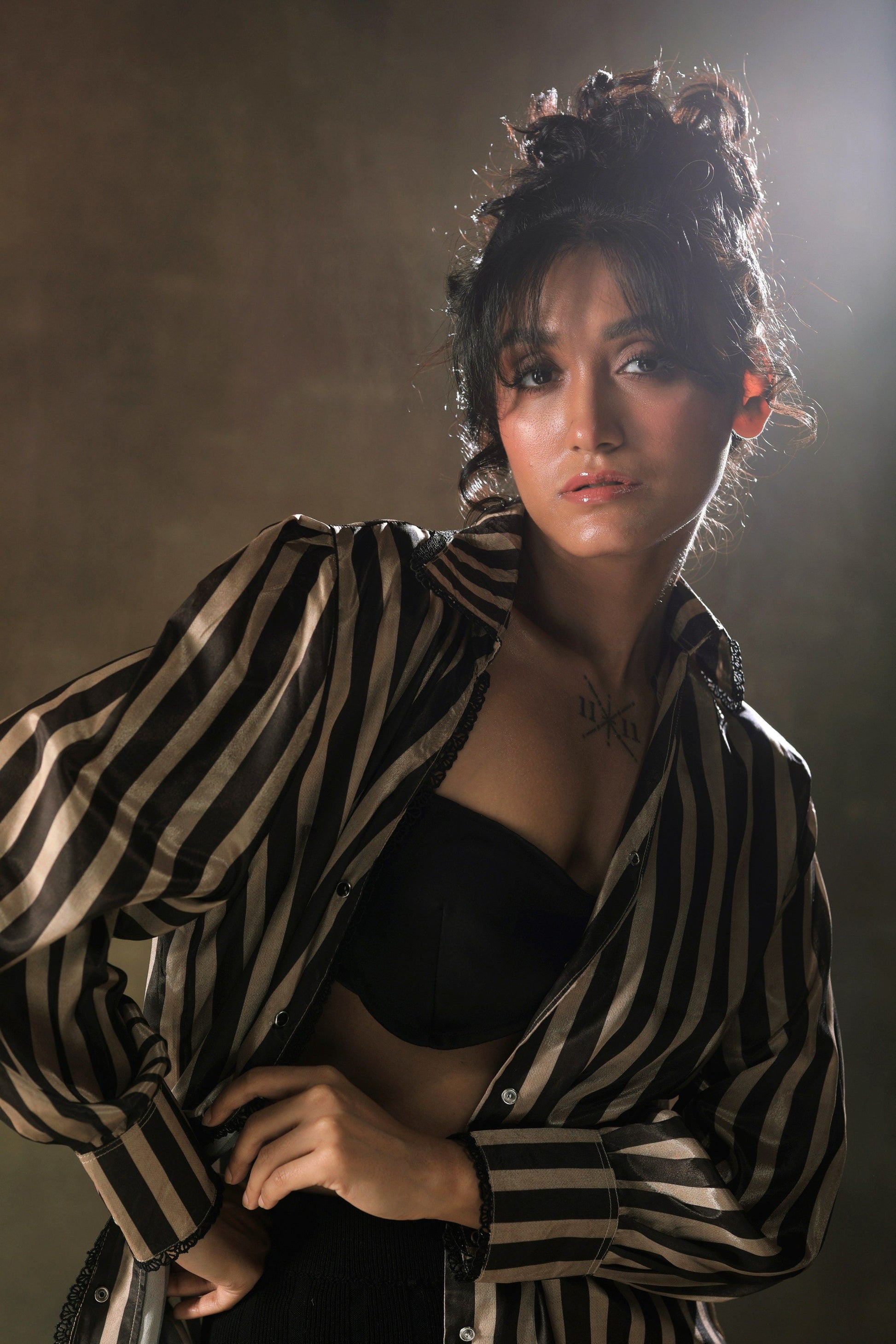 Oversized stripe shirt by 66aura featuring bold blue and white vertical stripes, relaxed fit, and classic button-down design.