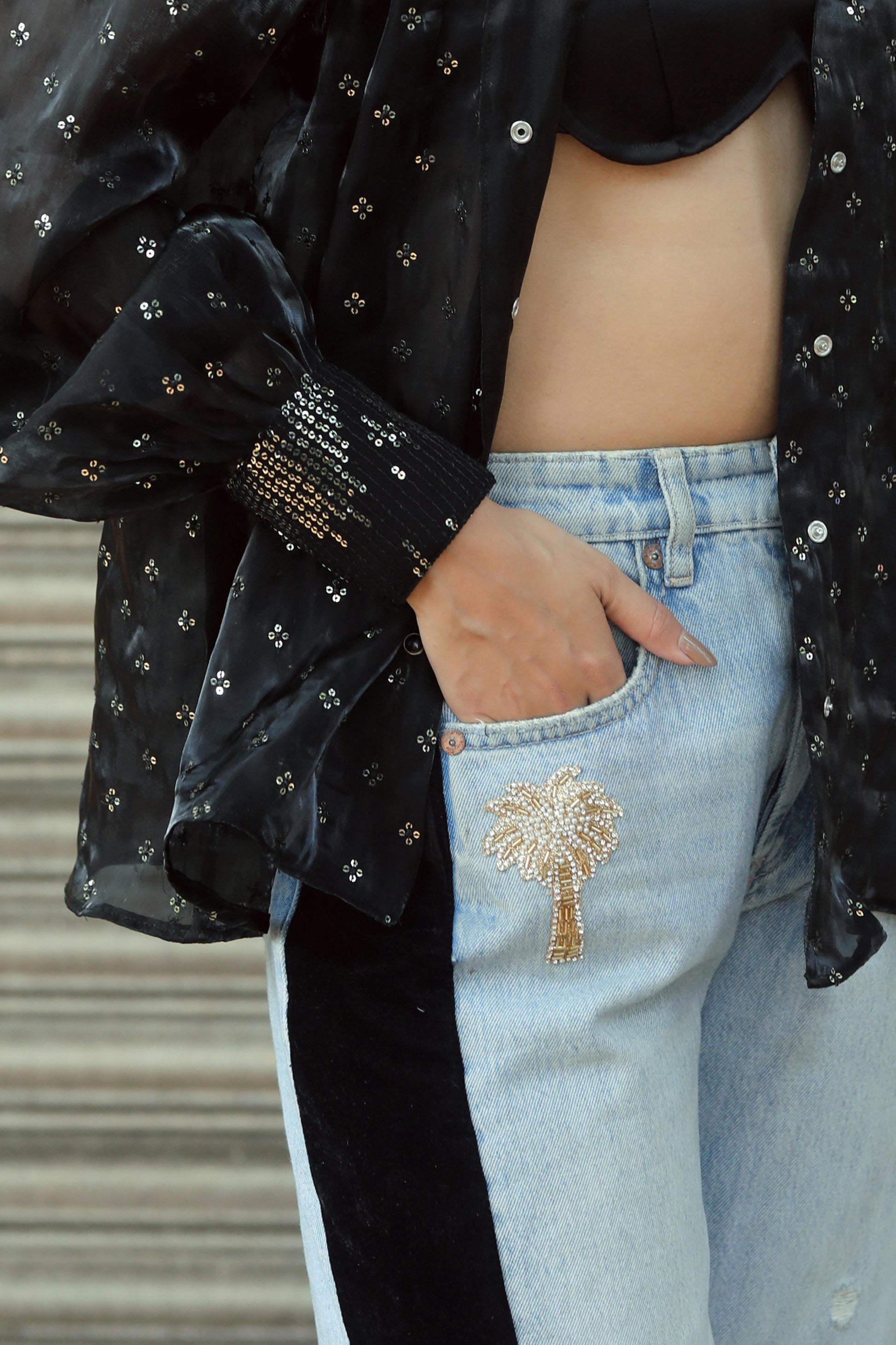 Pair of stylish BOSS BABE jeans by 66aura featuring a classic denim fit and distressed details.